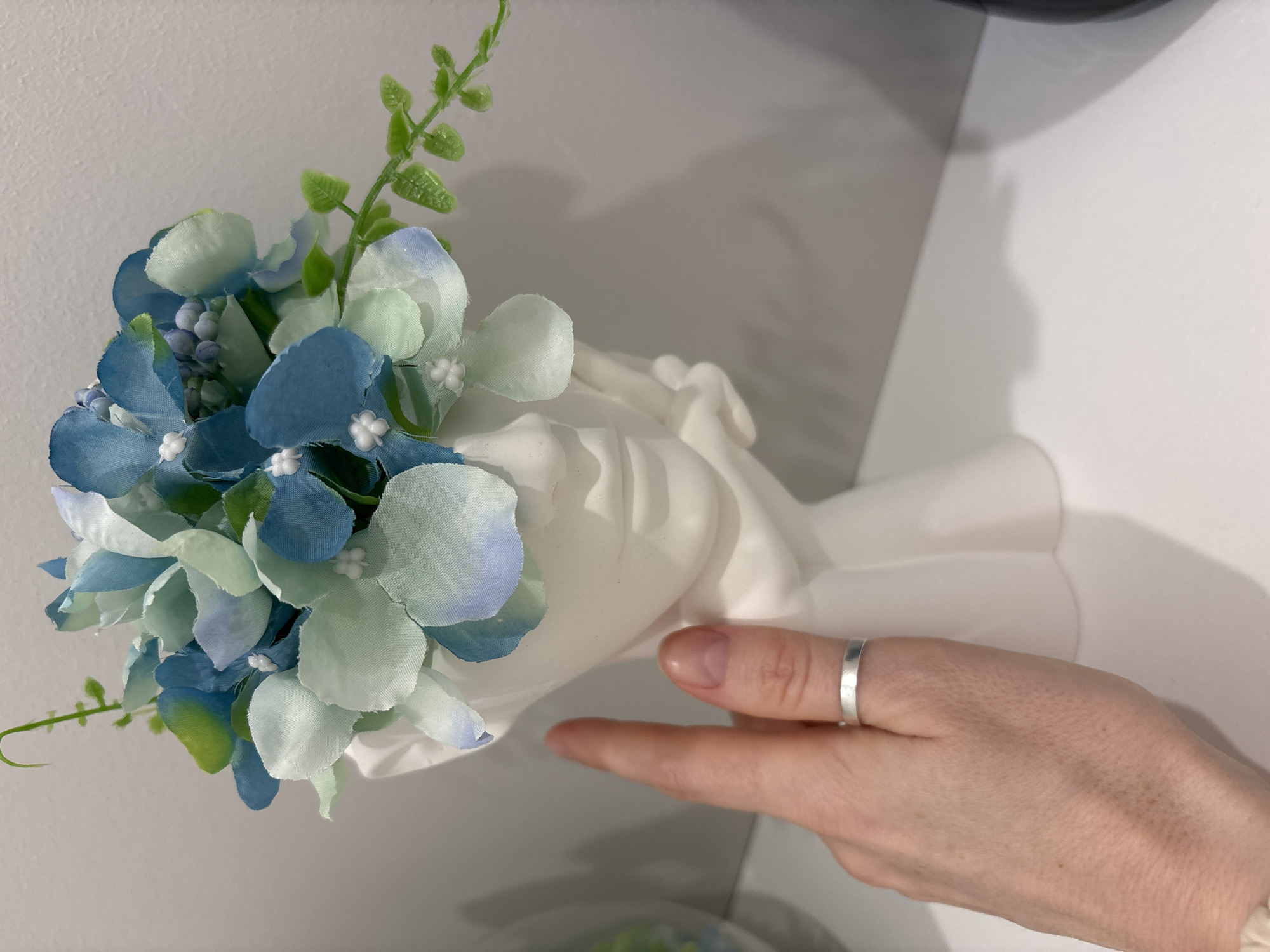 Woman documents flower arrangement and selfies in Saint Petersburg