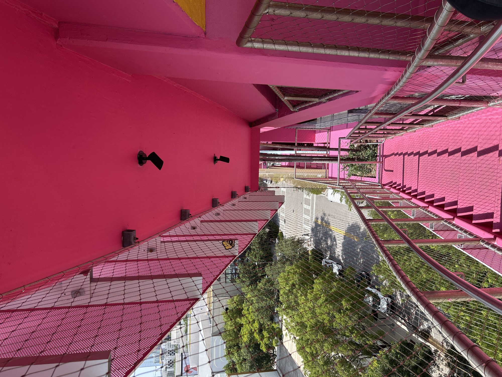 Colorful Miami storefronts and street-level architecture, mid-afternoon