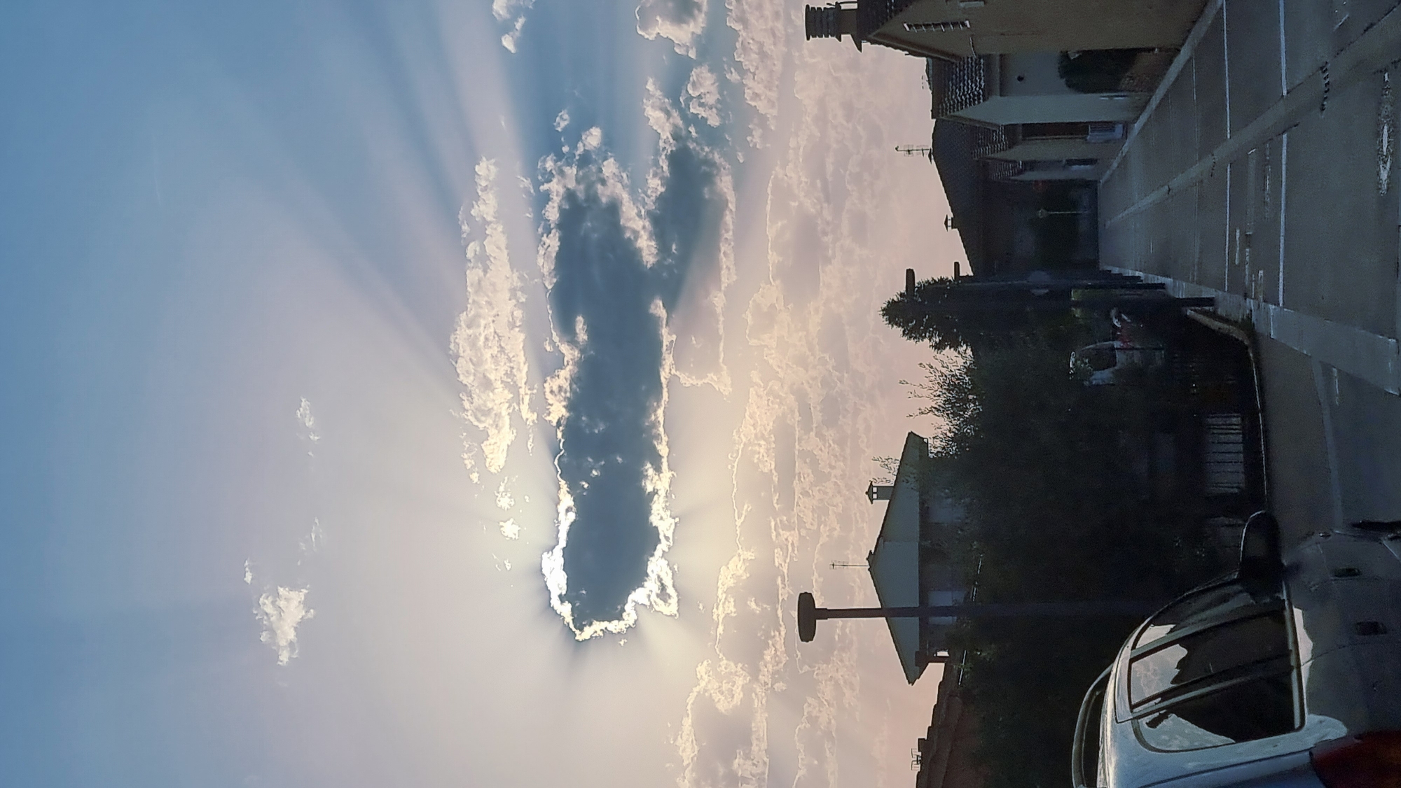 Sunrise skies and street signs in Sant Joan Les Fonts
