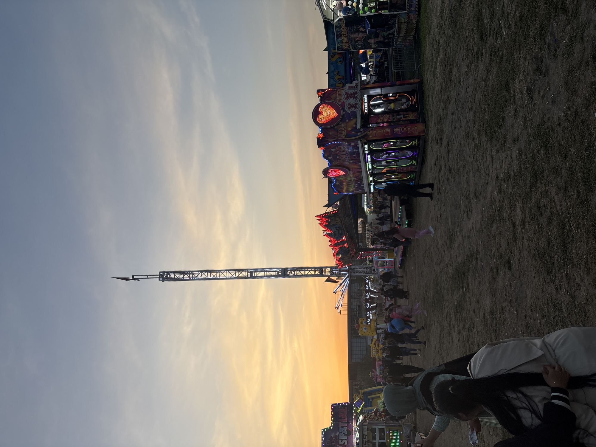 Fairground scenes captured by witnesses during evening hours