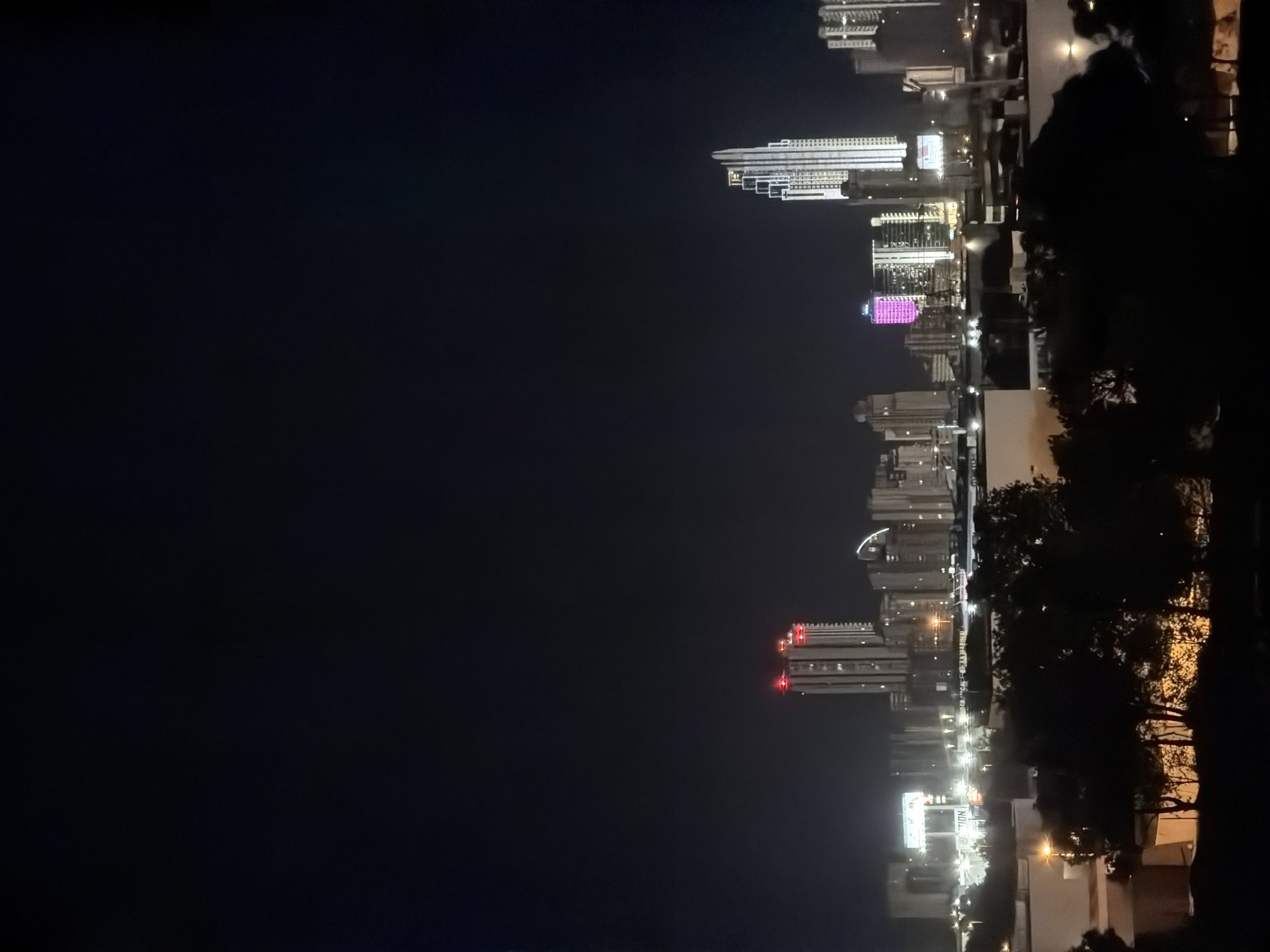 Finestrat's modern apartment skyline lit up at night