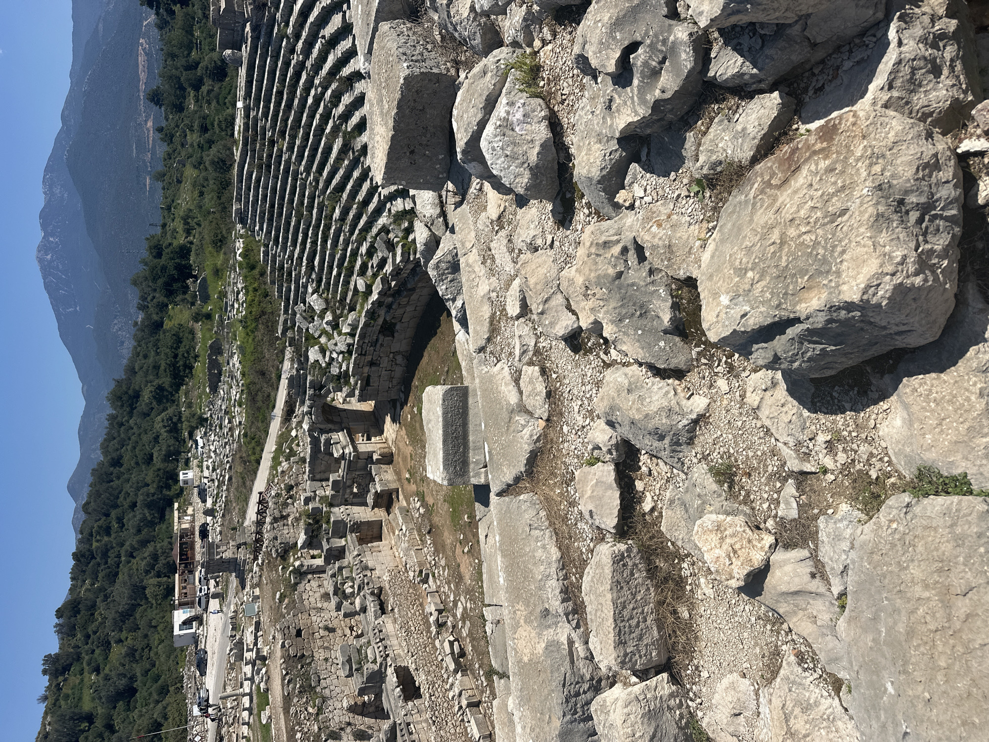 Tourist documents ancient Antiphellos ruins in Kaş, Turkey