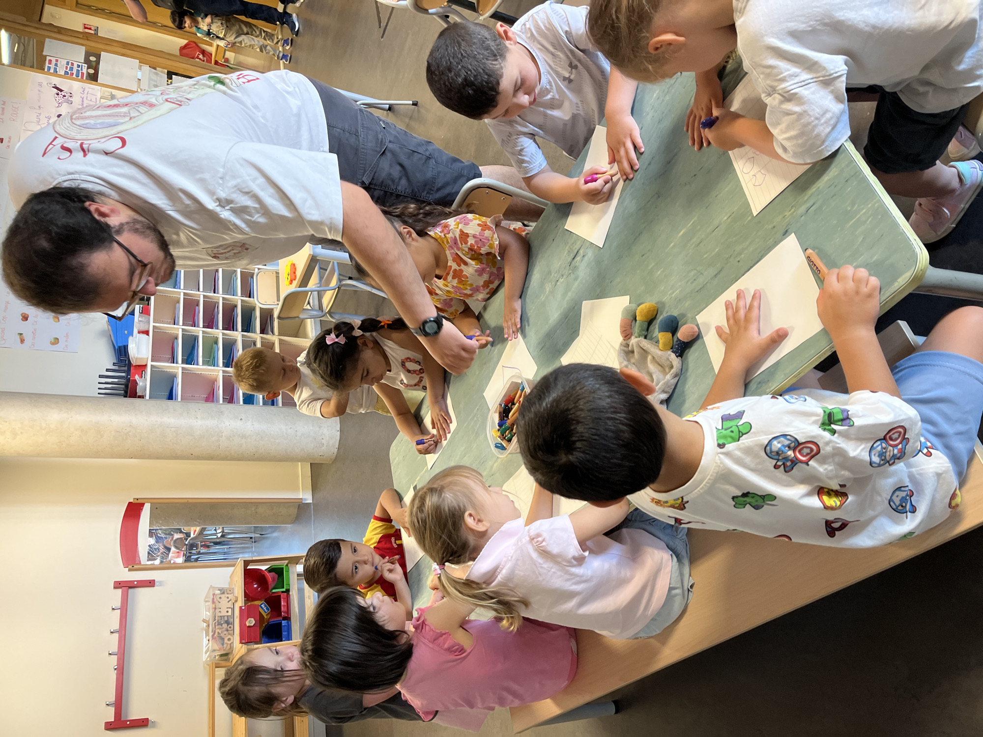 Children engage in supervised art activity in La Fouillouse classroom