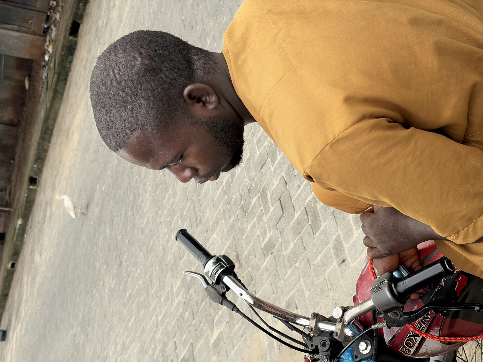 Everyday street life and overcast skies in Igboefon, Nigeria