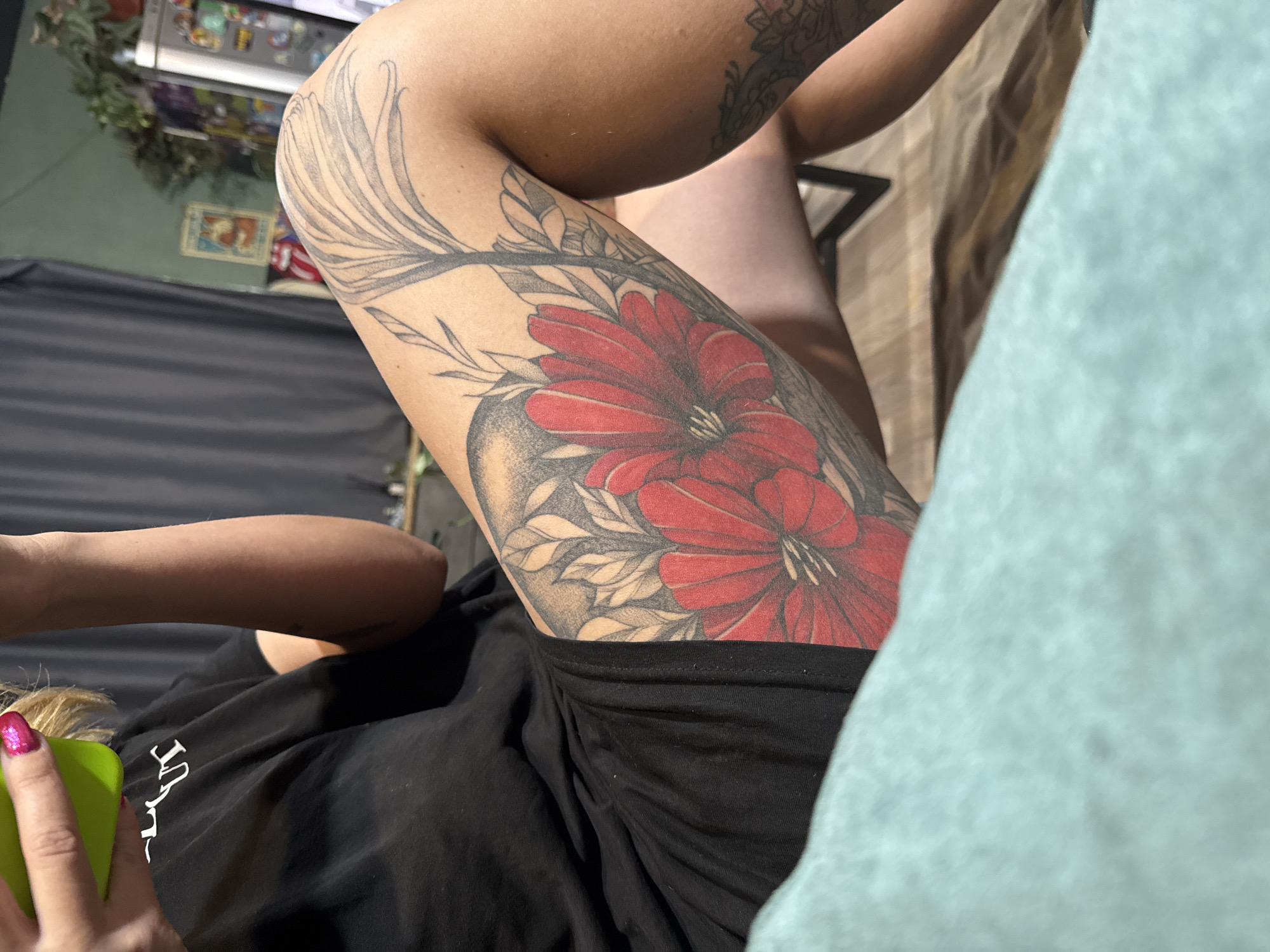 Person displays floral and patterned tattoo artwork in Russia