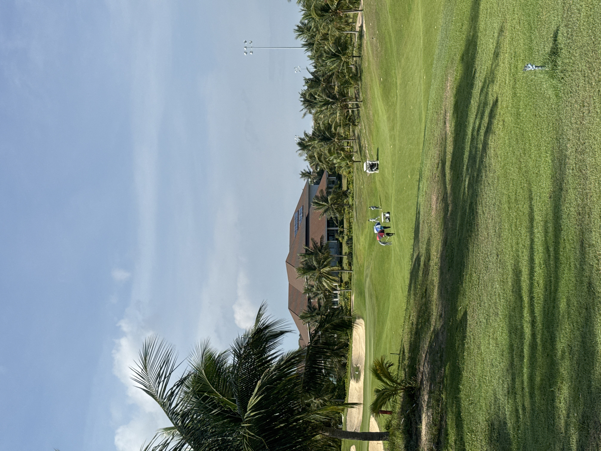 Golf round in progress at a tropical resort course, Phú Thủy
