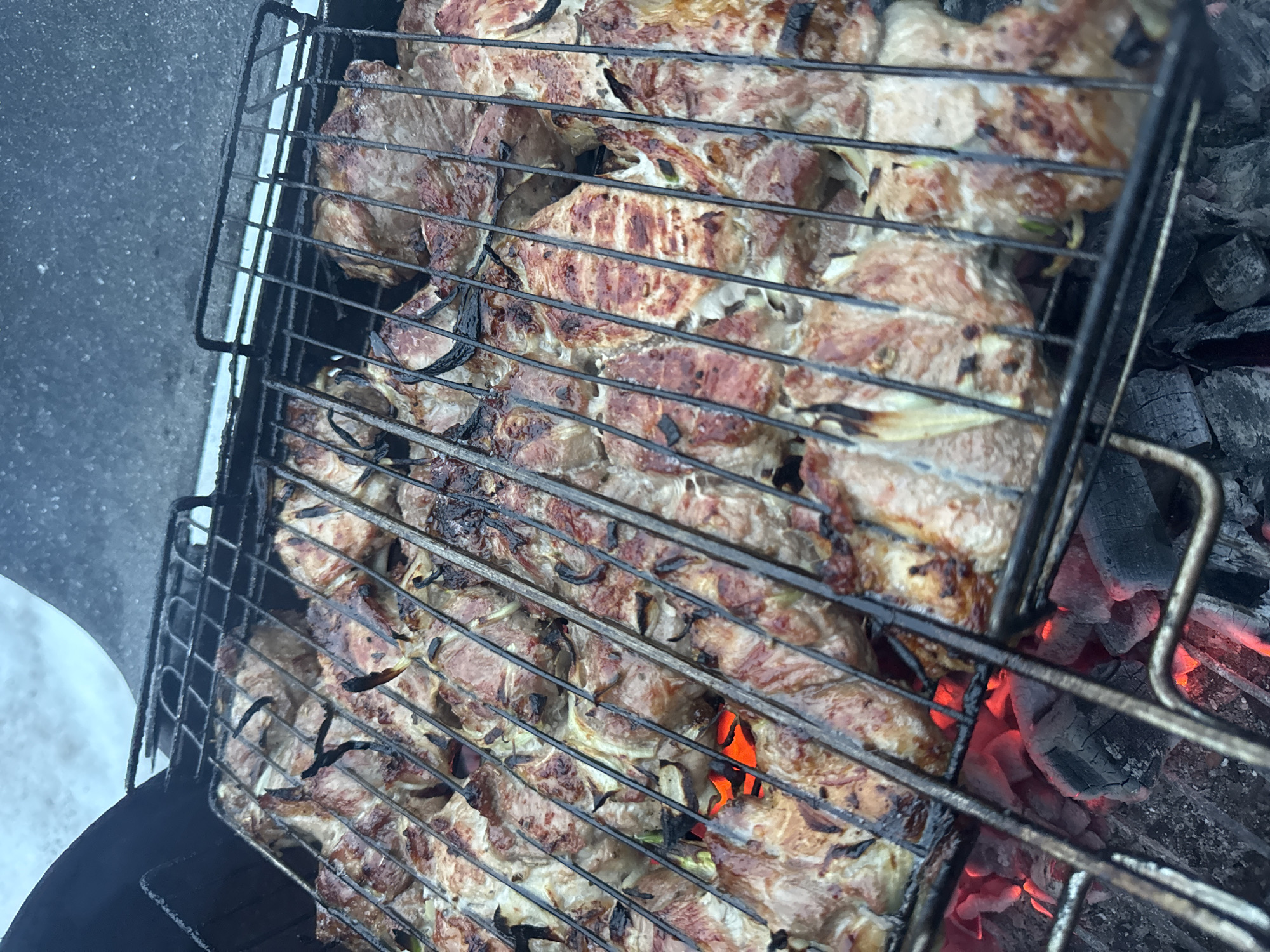 Family barbecue gathering documented in Chaikovsky, Russia during winter