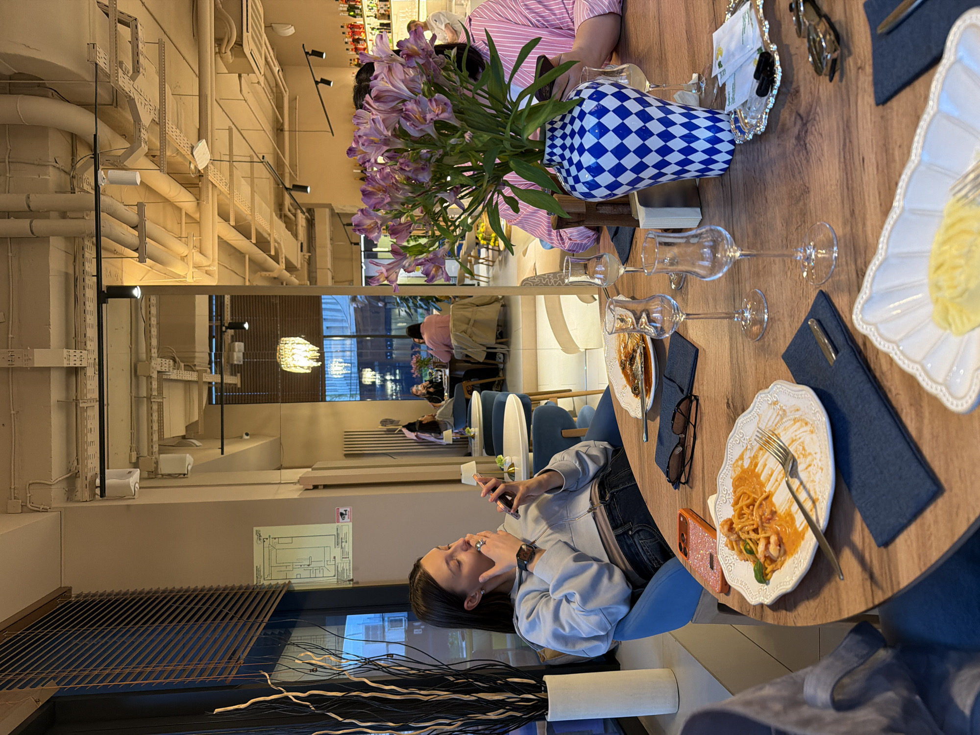 Group dining captured at Khimki restaurant during evening hours