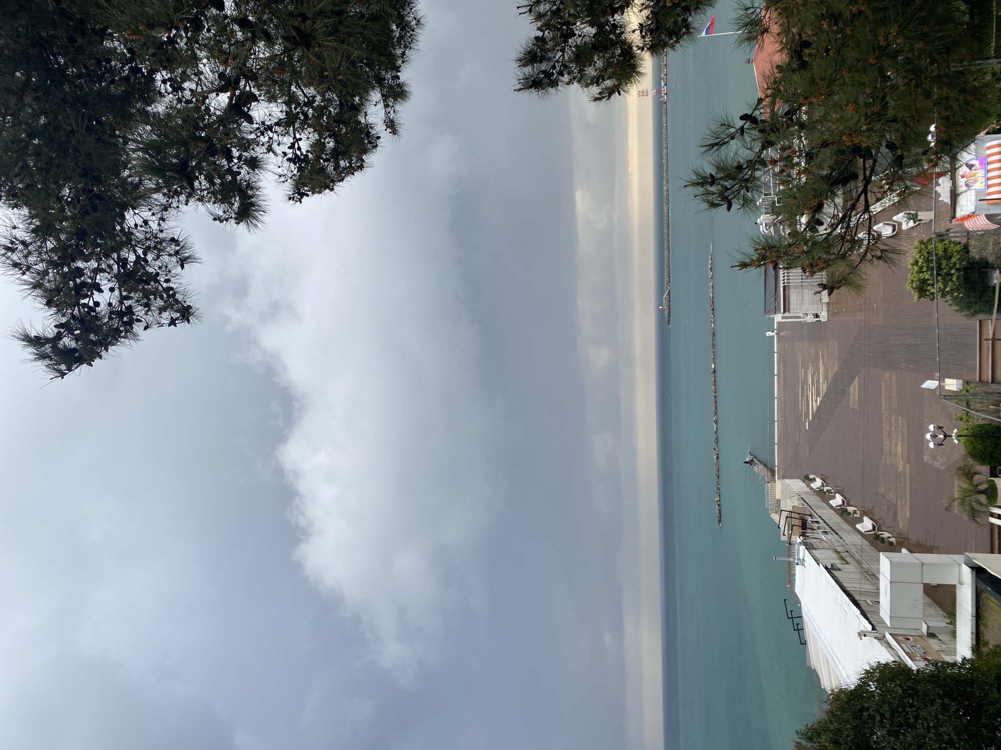 Tourist captures scenic views around Sochi waterfront under overcast skies