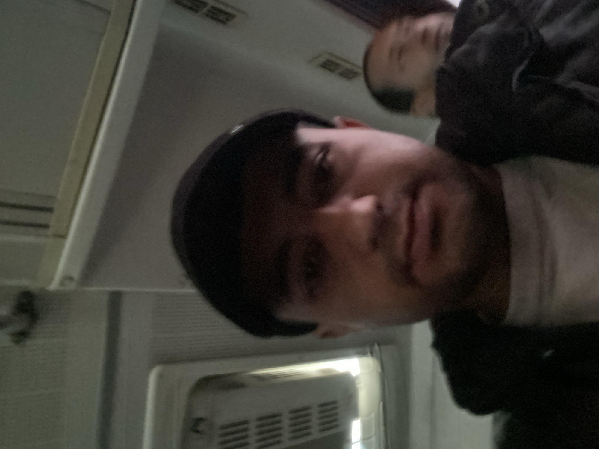 Two people photographed in vehicle interior in Bukhara