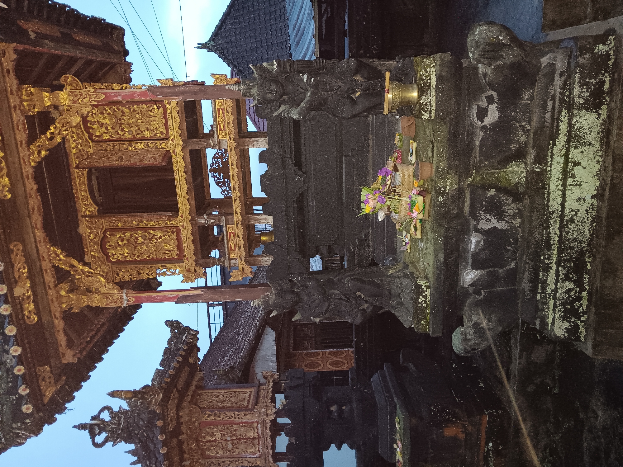 Morning observations capture Balinese architecture and baseball cap in Penebel