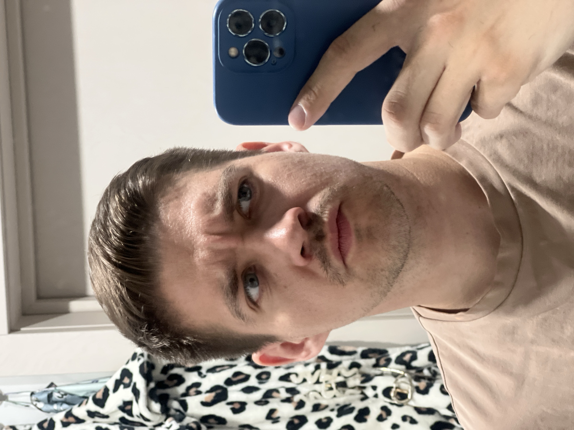 Man takes selfies in Kazan apartment setting
