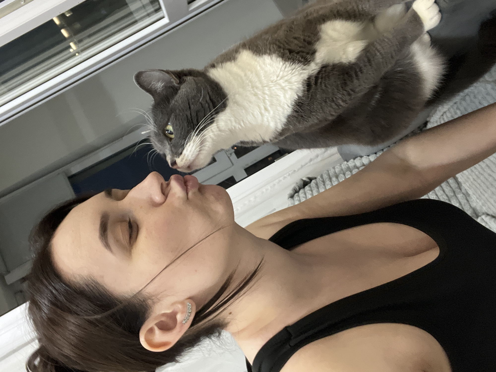 Woman and cat captured in quiet domestic moments in Tyumen