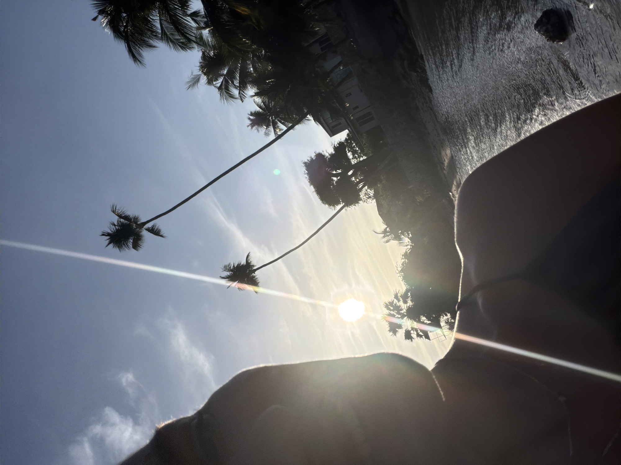 Sunset at Ko Samui's Big Buddha — selfies, a rooster, and a landing plane