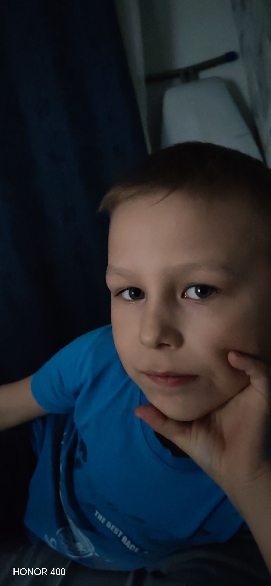 Boy rests at home with dog, Olivier salad in Noviy