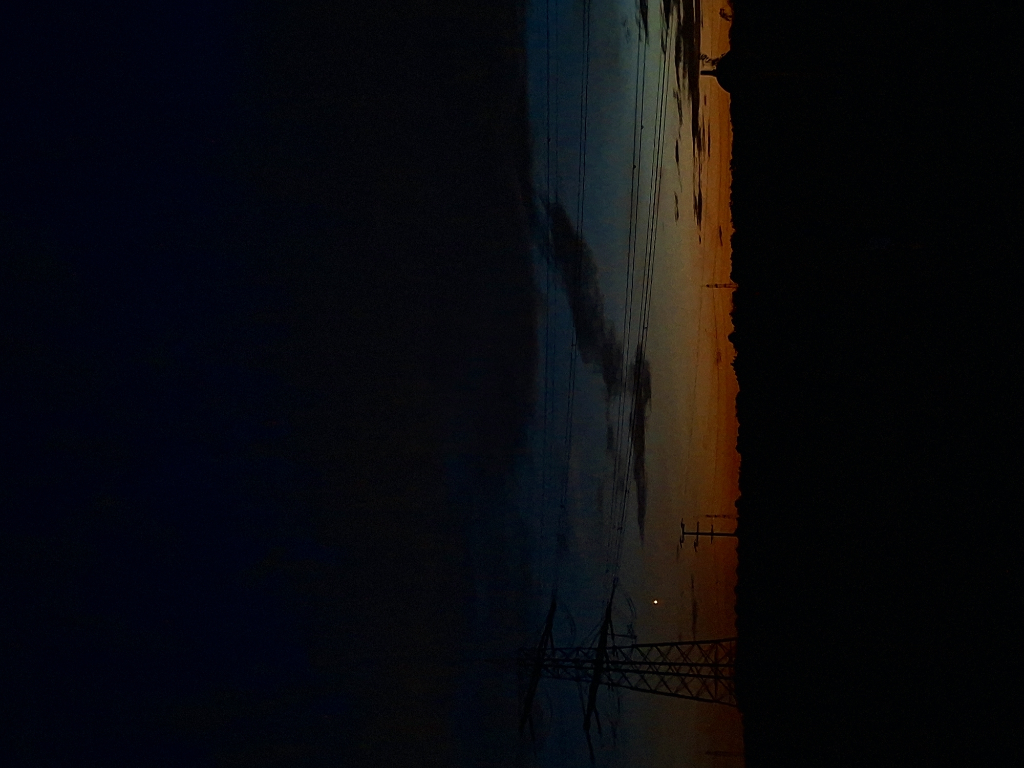Evening out near a glowing glass venue, pylons, and city streets