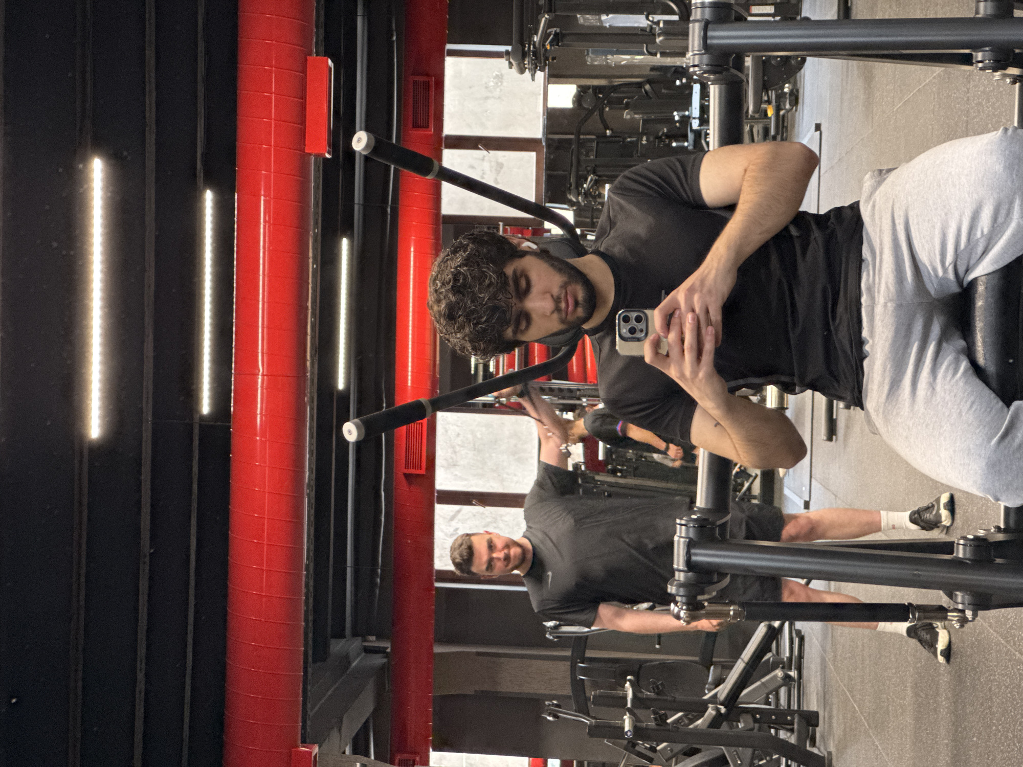 Morning gym session captured in Yerevan, man checks phone
