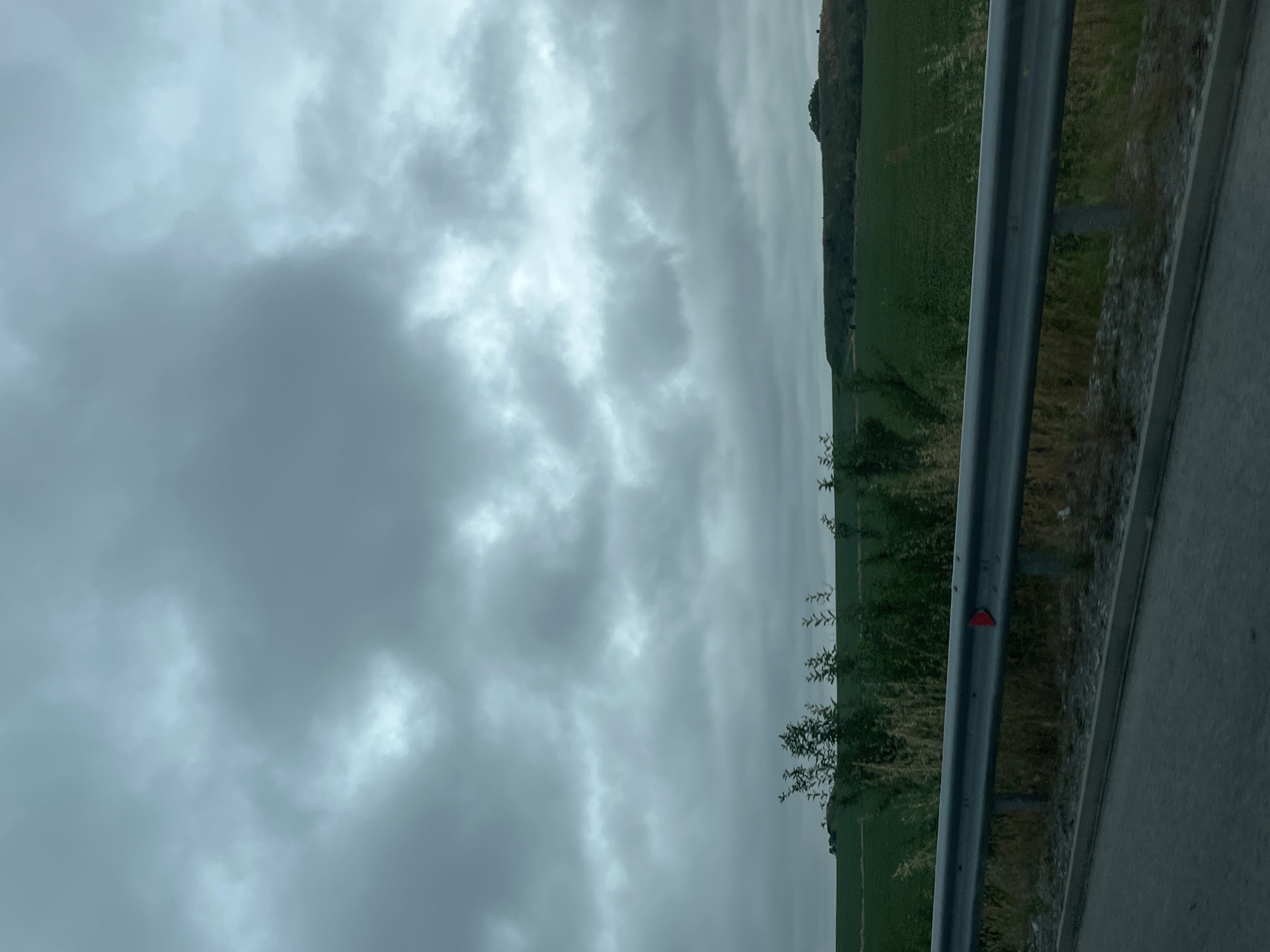 Rural road journey documented through countryside landscapes and villages