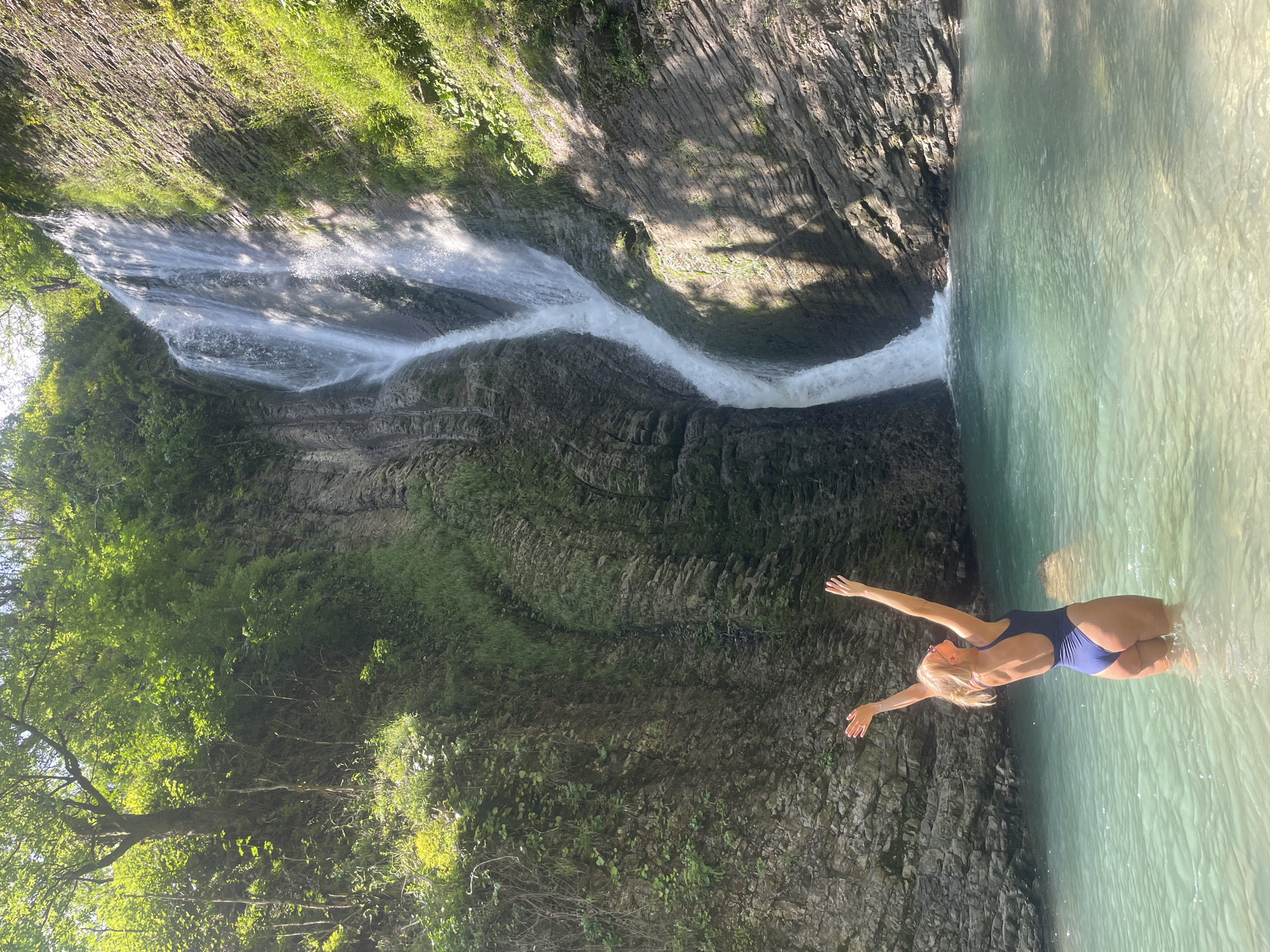 Family visits scenic waterfall destination in Plastunka, Russia