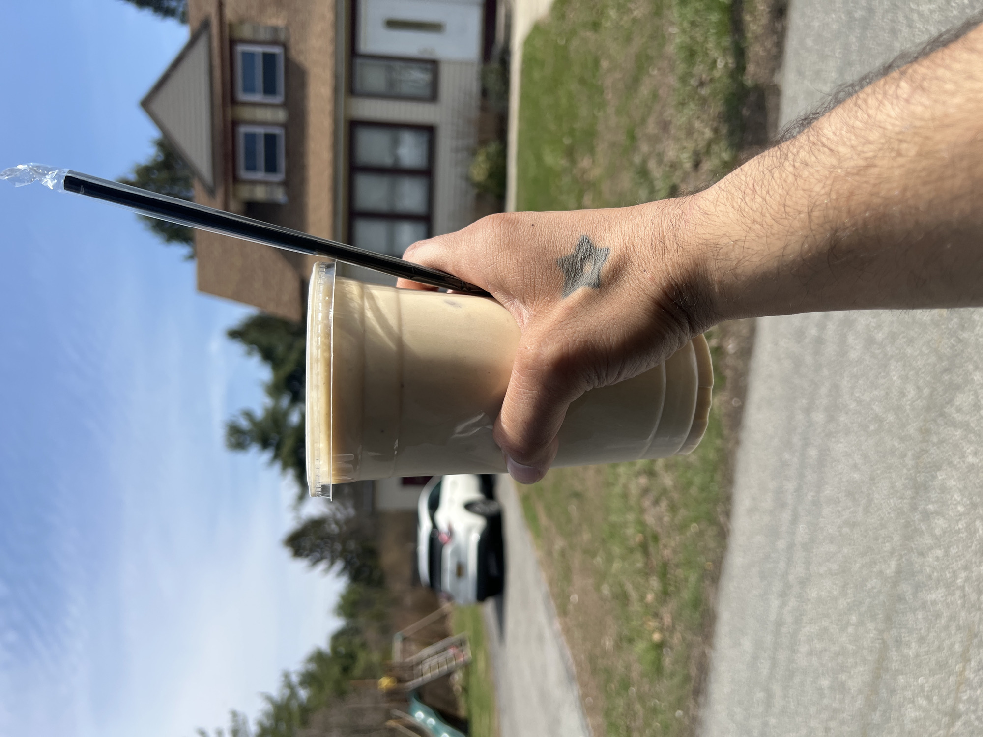Person enjoys iced coffee in New Windsor