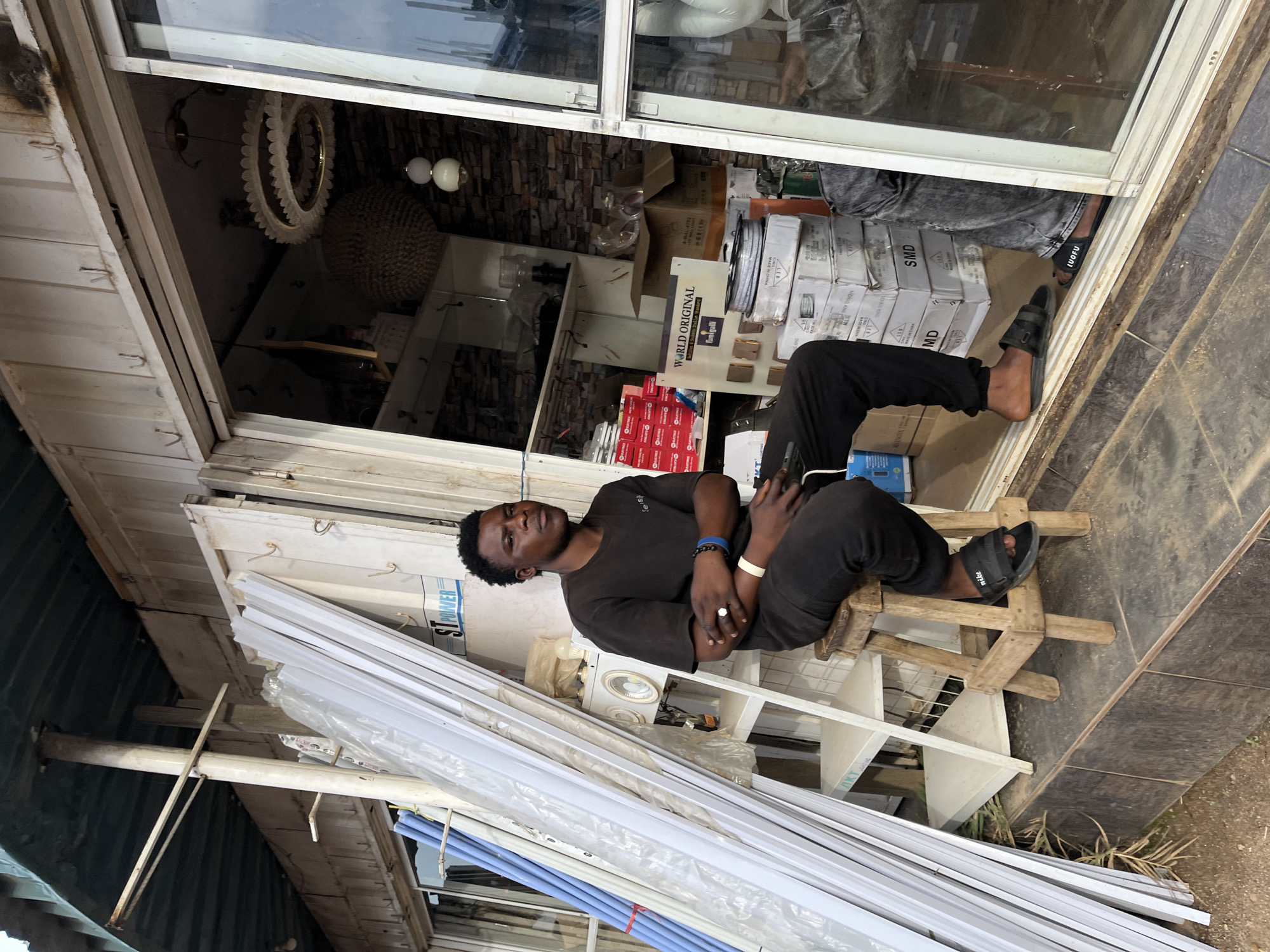 Everyday street life along a commercial strip in Gura Top, Nigeria