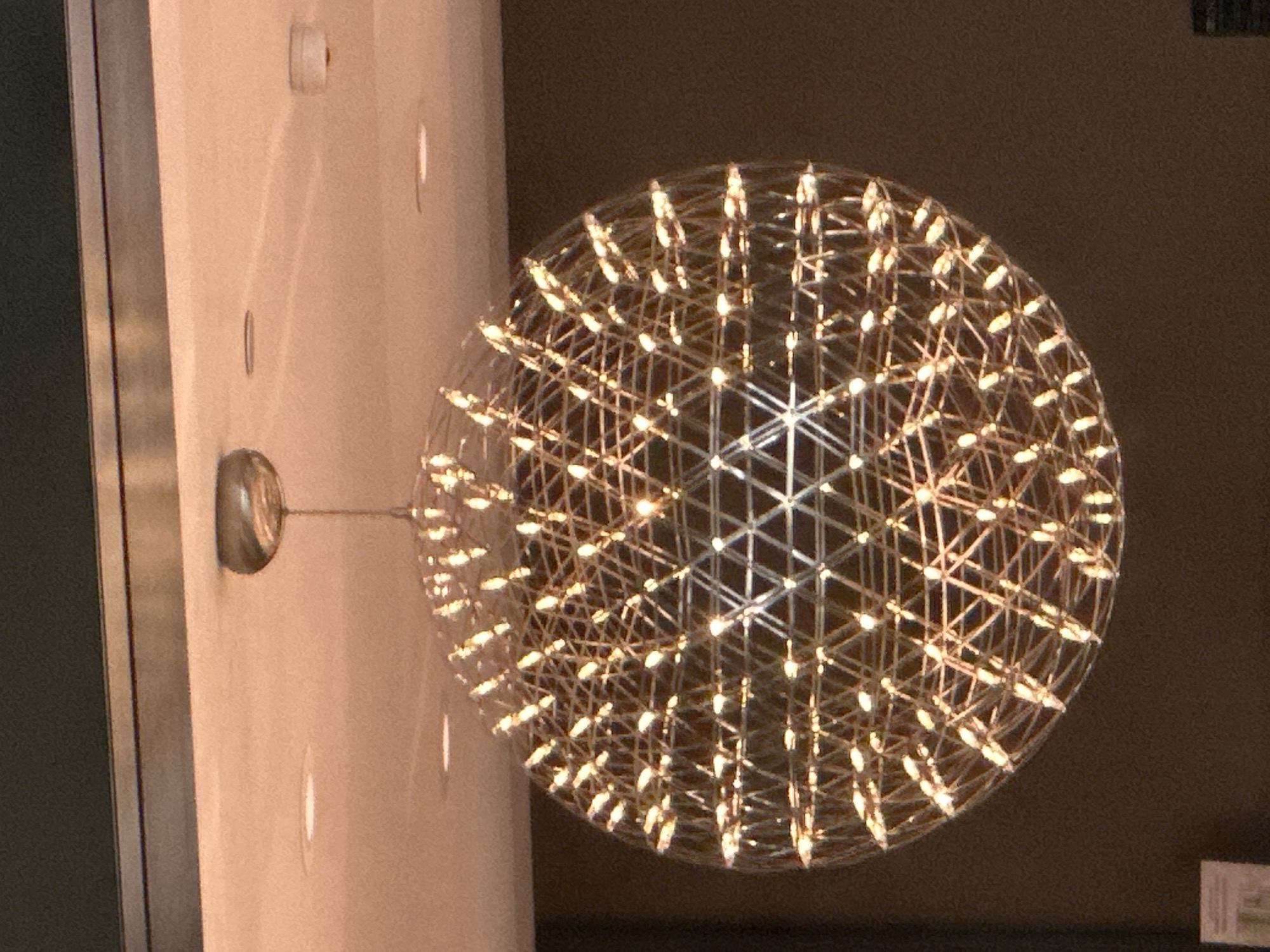Geometric spherical chandelier documented in Burnaby indoor space