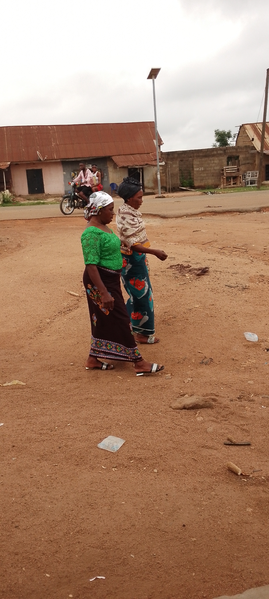 Morning street life on a dusty road in a small African town