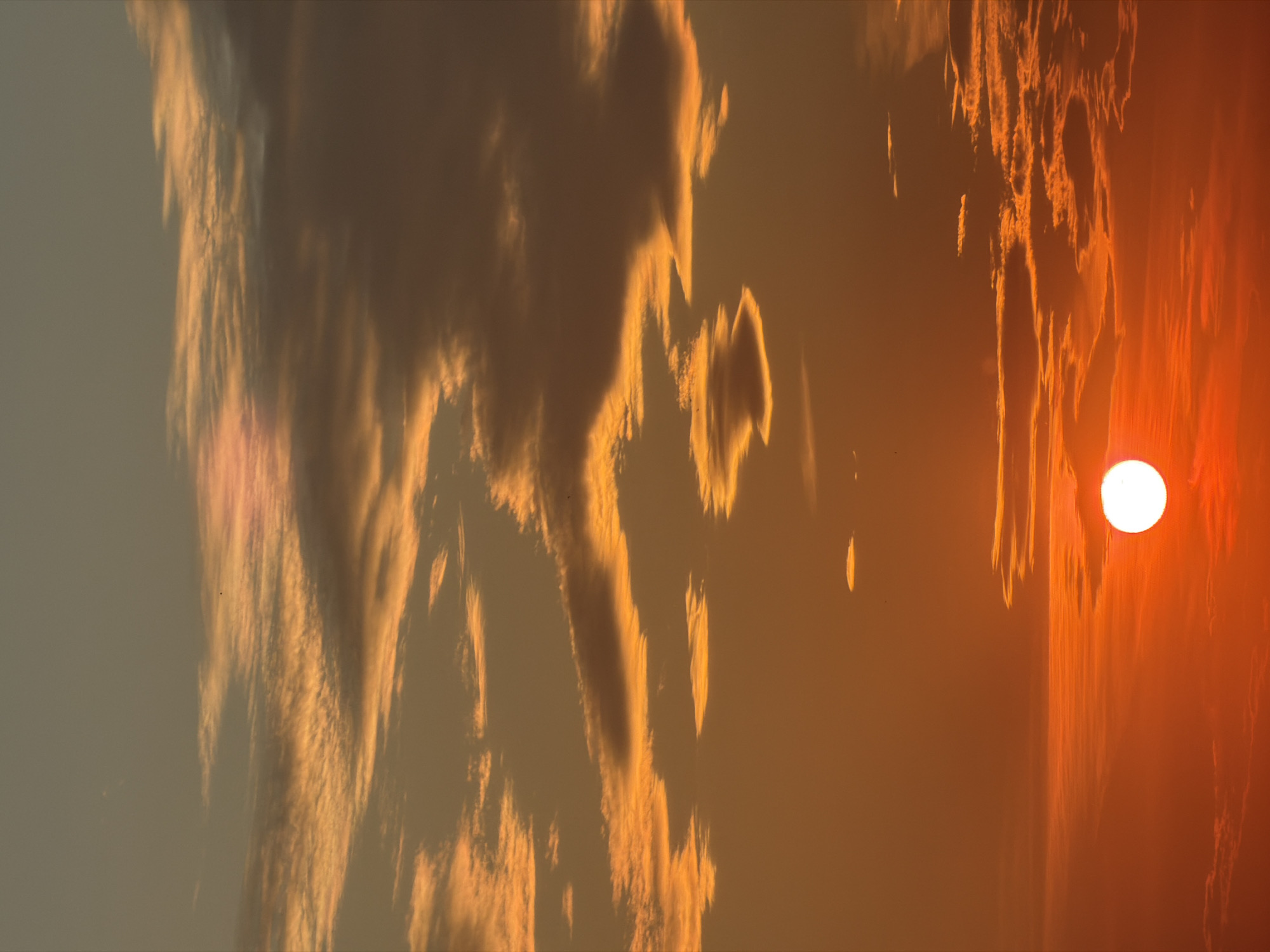 Dramatic sunset with orange clouds captured by witnesses