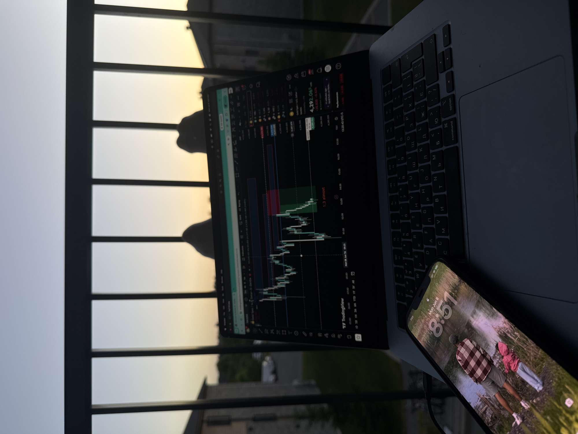 Late-night balcony trading session with cat companion in Gatineau