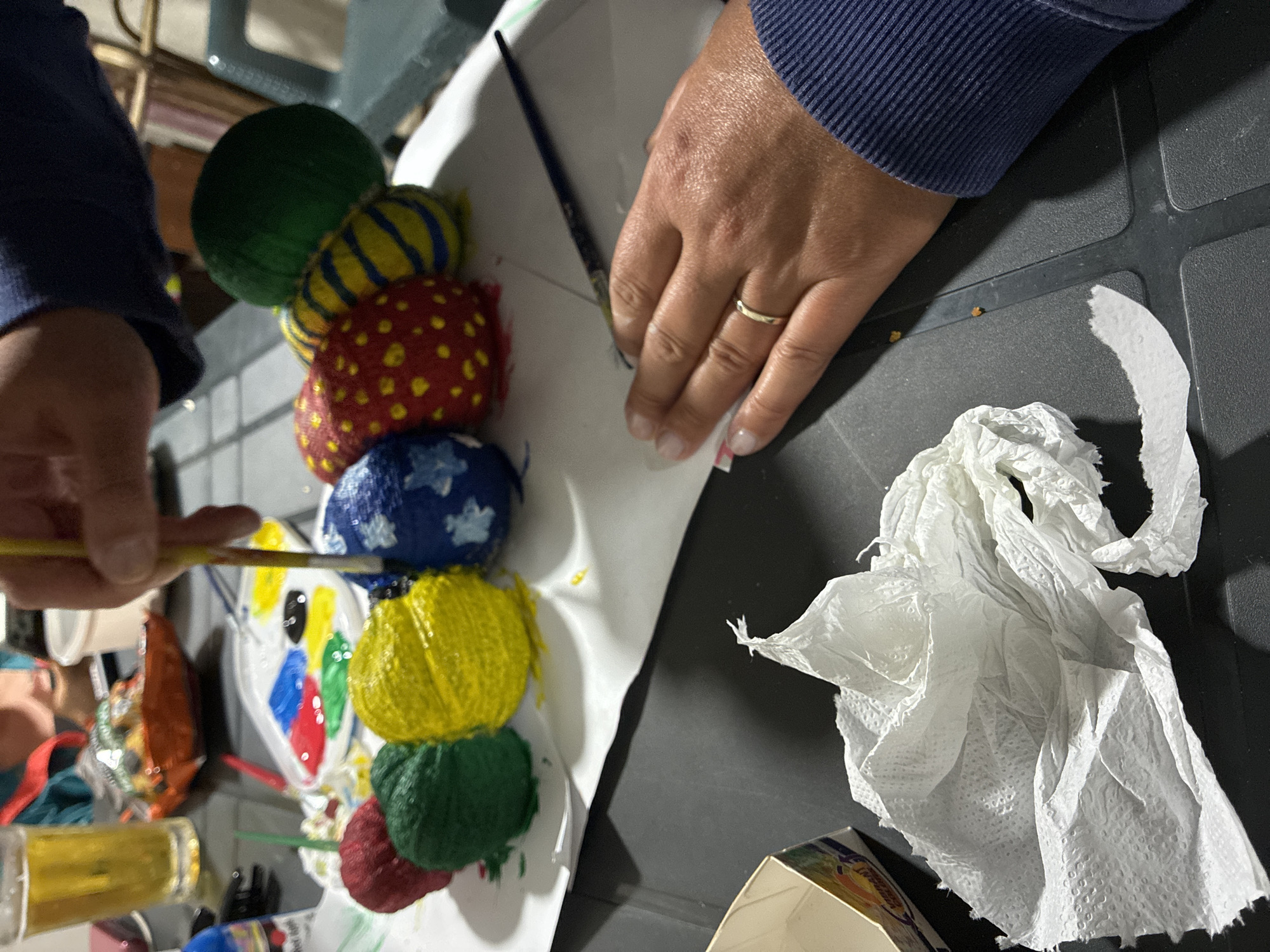 Painted rock caterpillar takes shape in a Surami garden