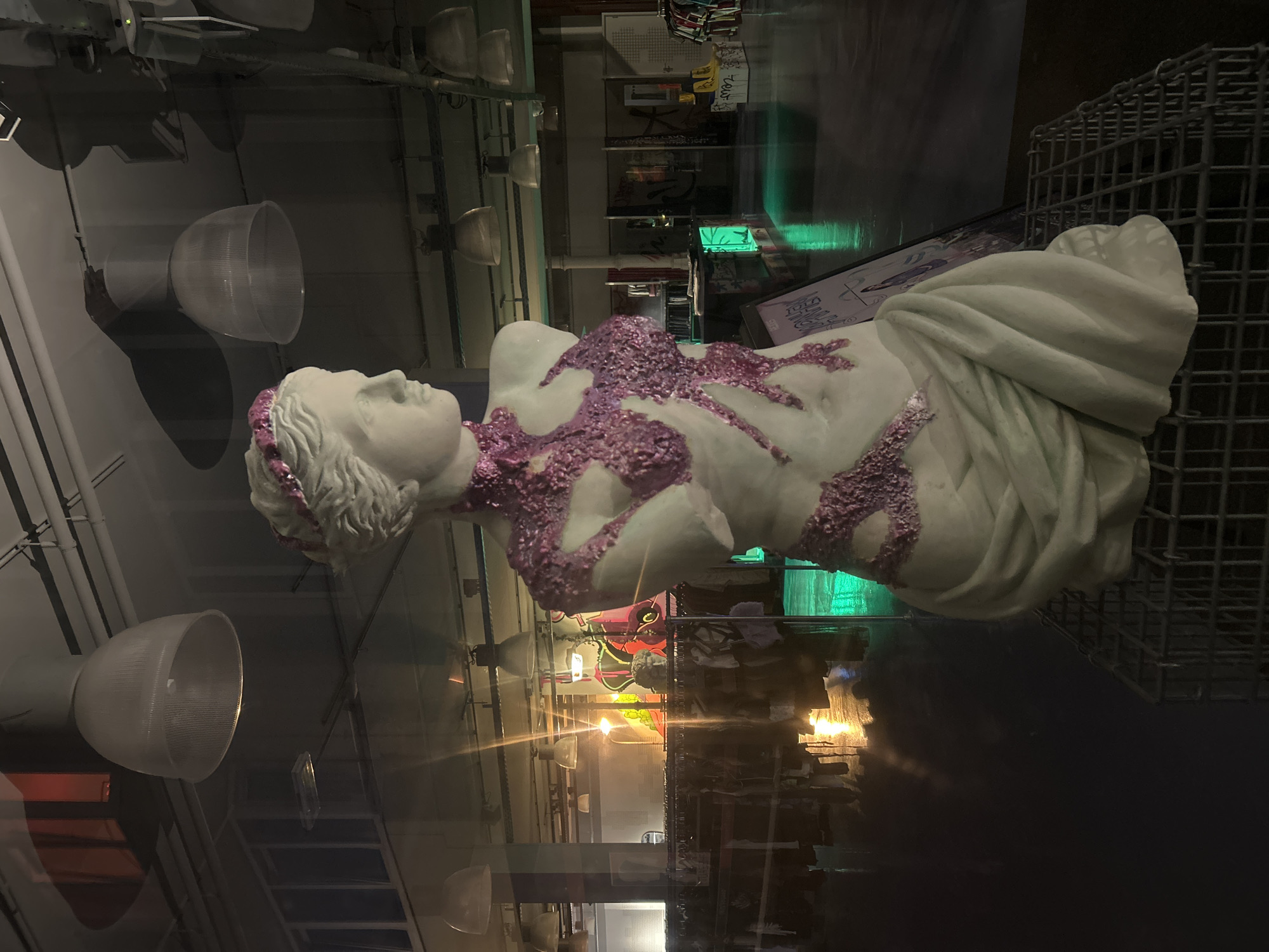 Marble sculpture with purple coral covering displayed in Arnhem