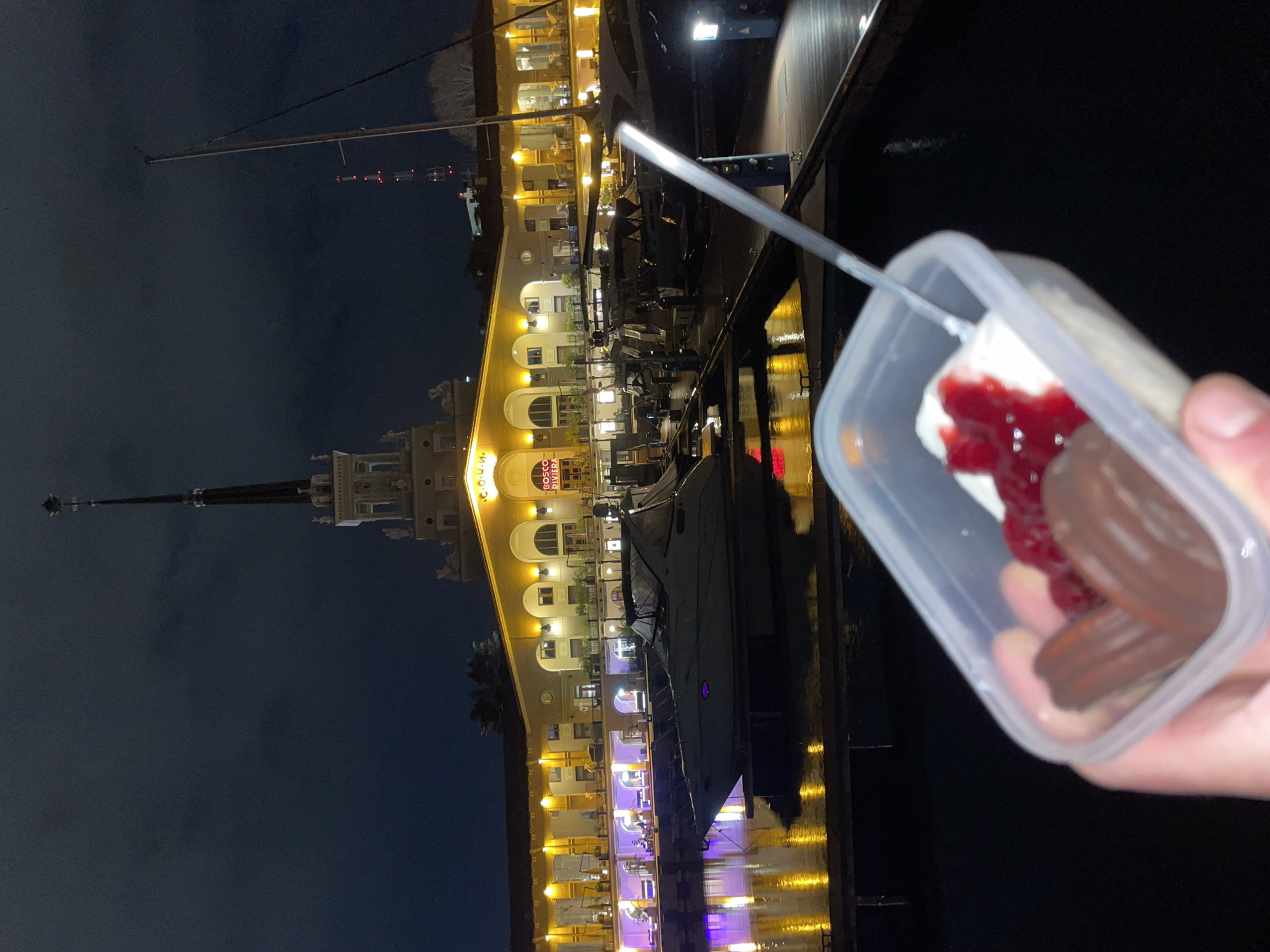 Person photographed with layered dessert container in Sochi