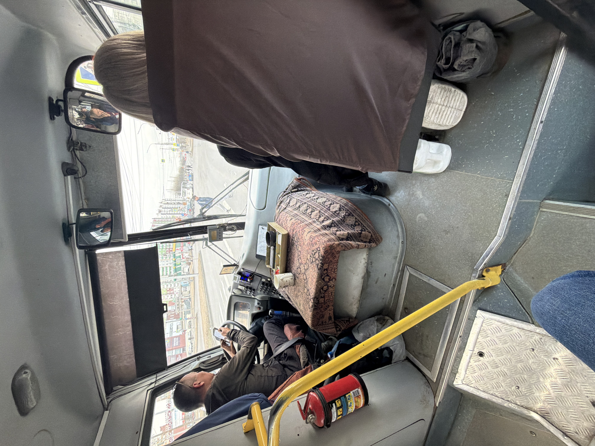 Bus driver uses smartphone while on duty in Krasnoyarsk