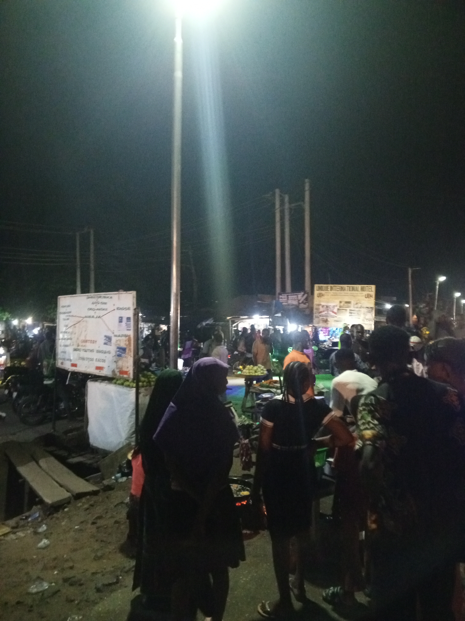 Street gathering with vendors and children's musical event