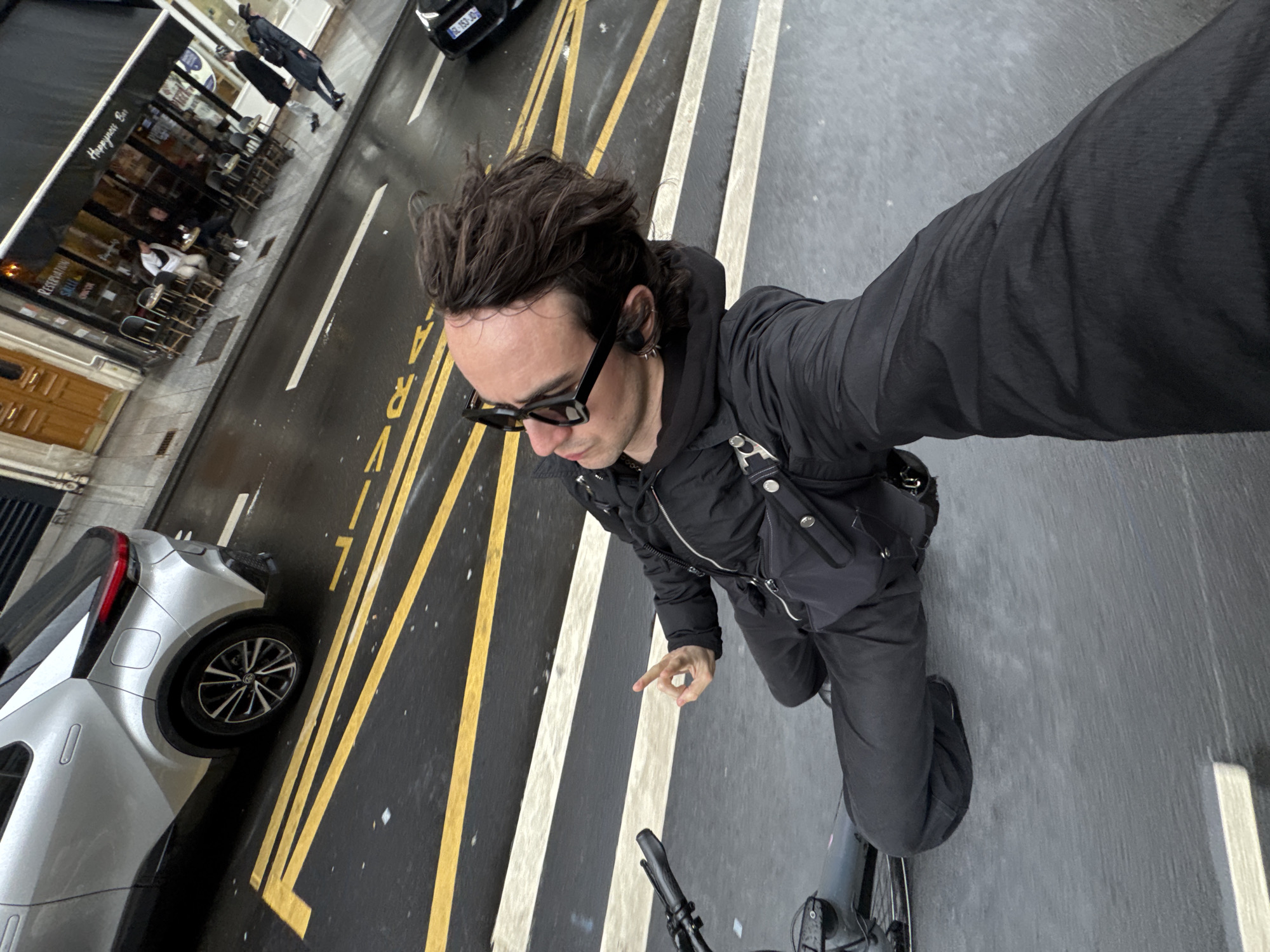 Cyclist rides designated bike lane in Paris