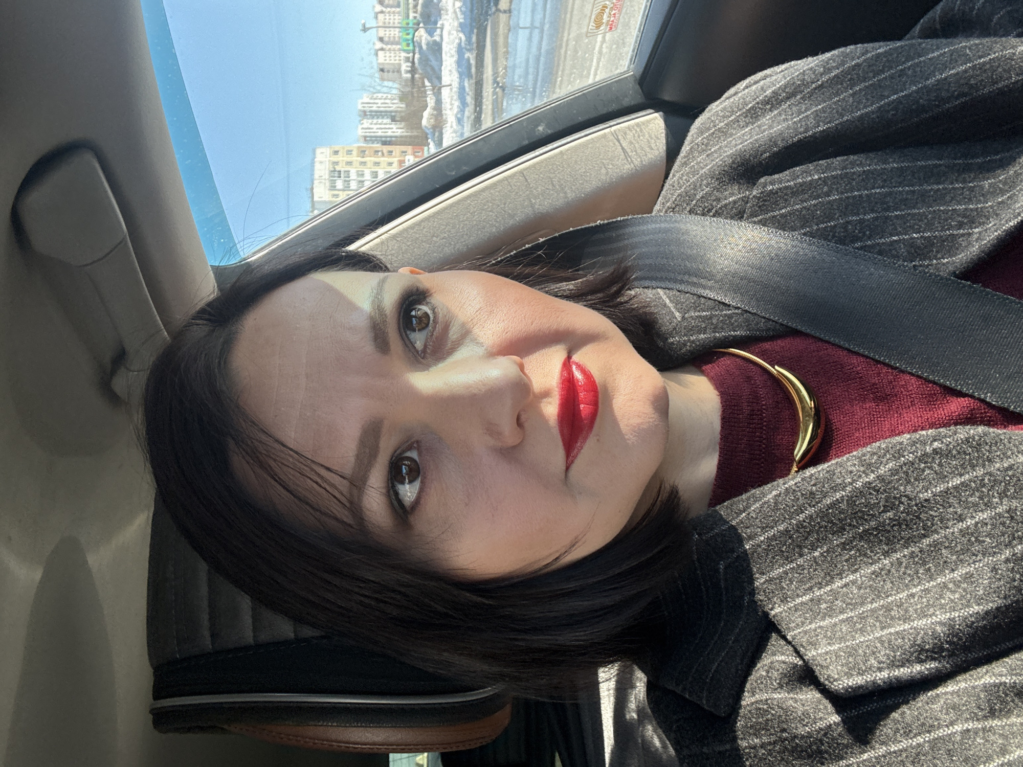 Woman in professional attire observed in car in Nizhnevartovsk