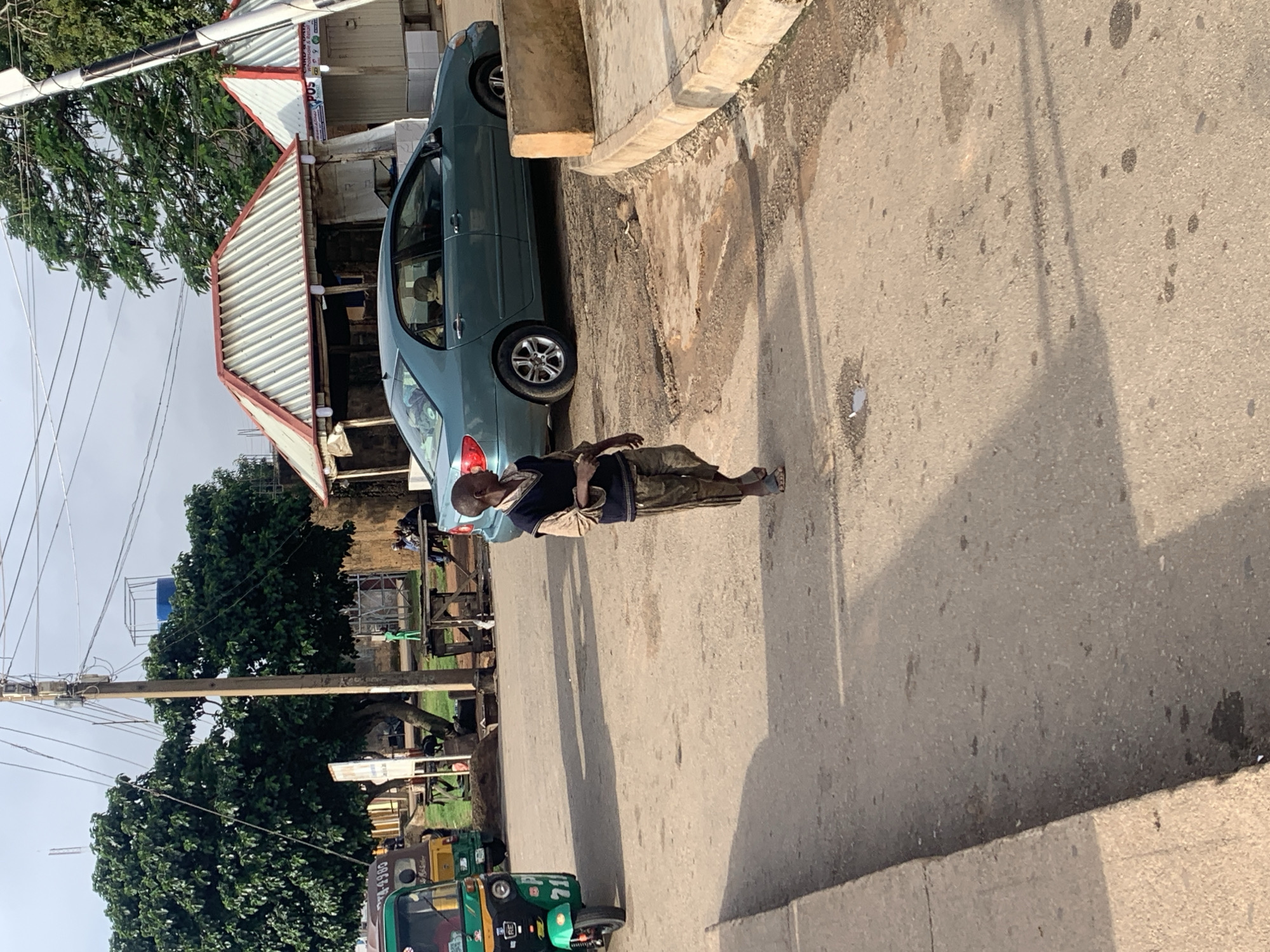 Morning street life around Jos, Nigeria's auto-rickshaw routes