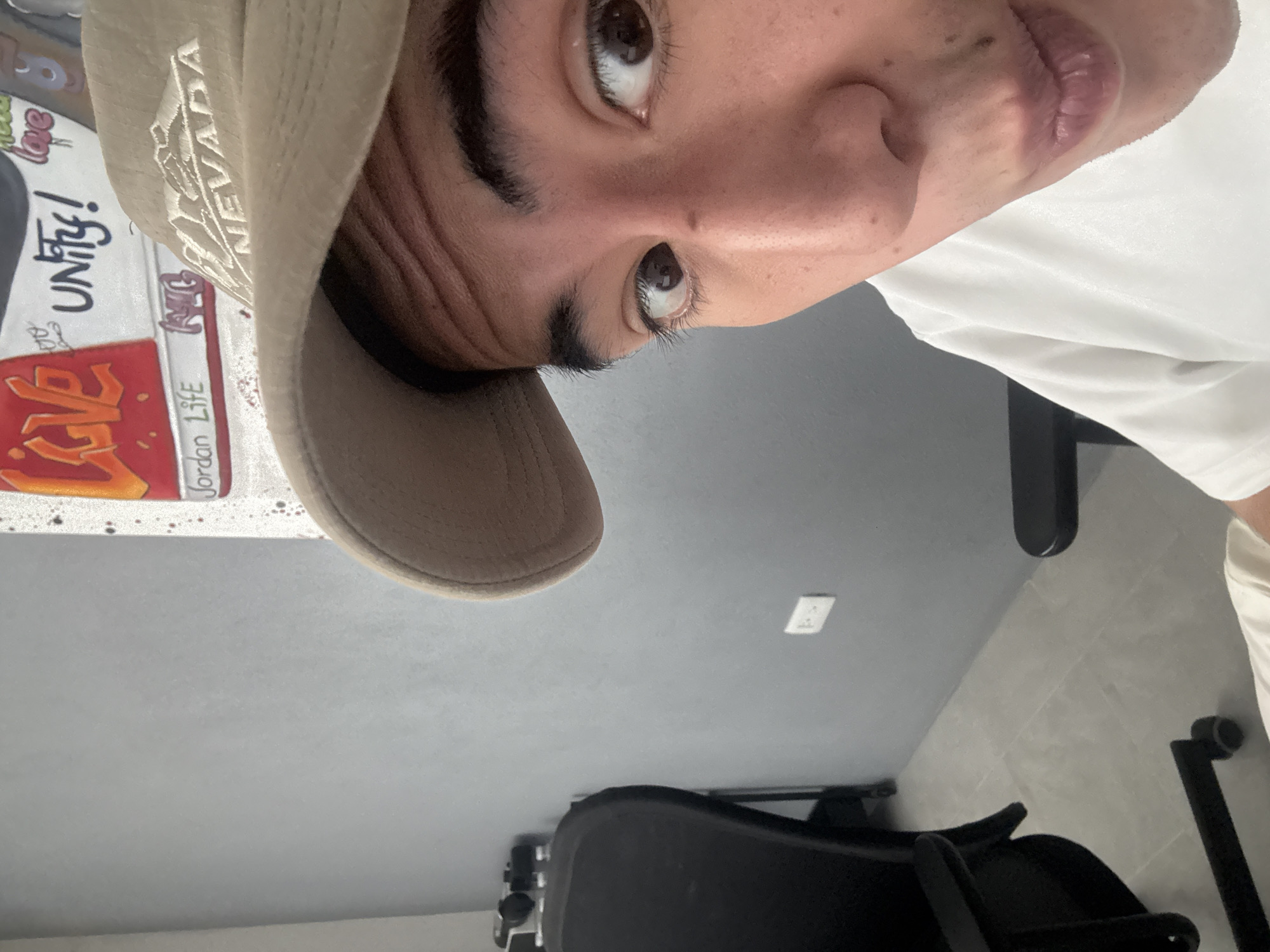 Indoor snapshots from Puebla: hats, a video call, and sneaker art