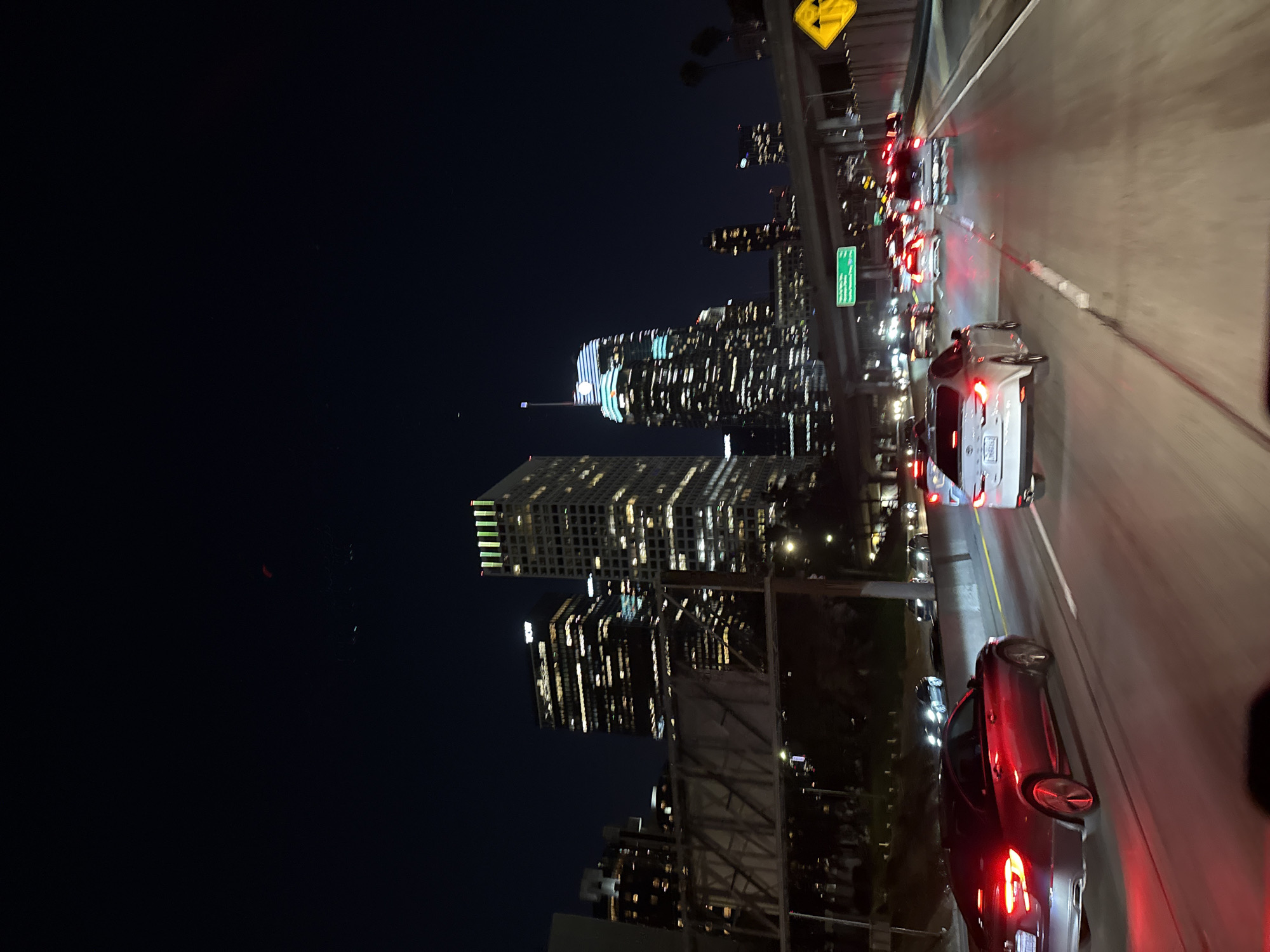 Early morning highway traffic flows past downtown Los Angeles