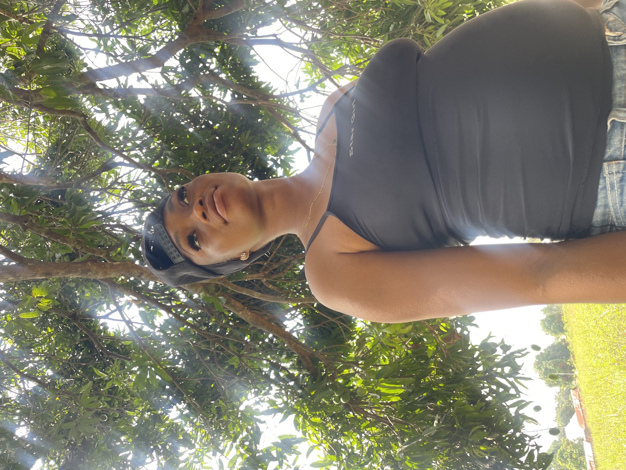 Woman gazes skyward in rural Ogbe, Nigeria
