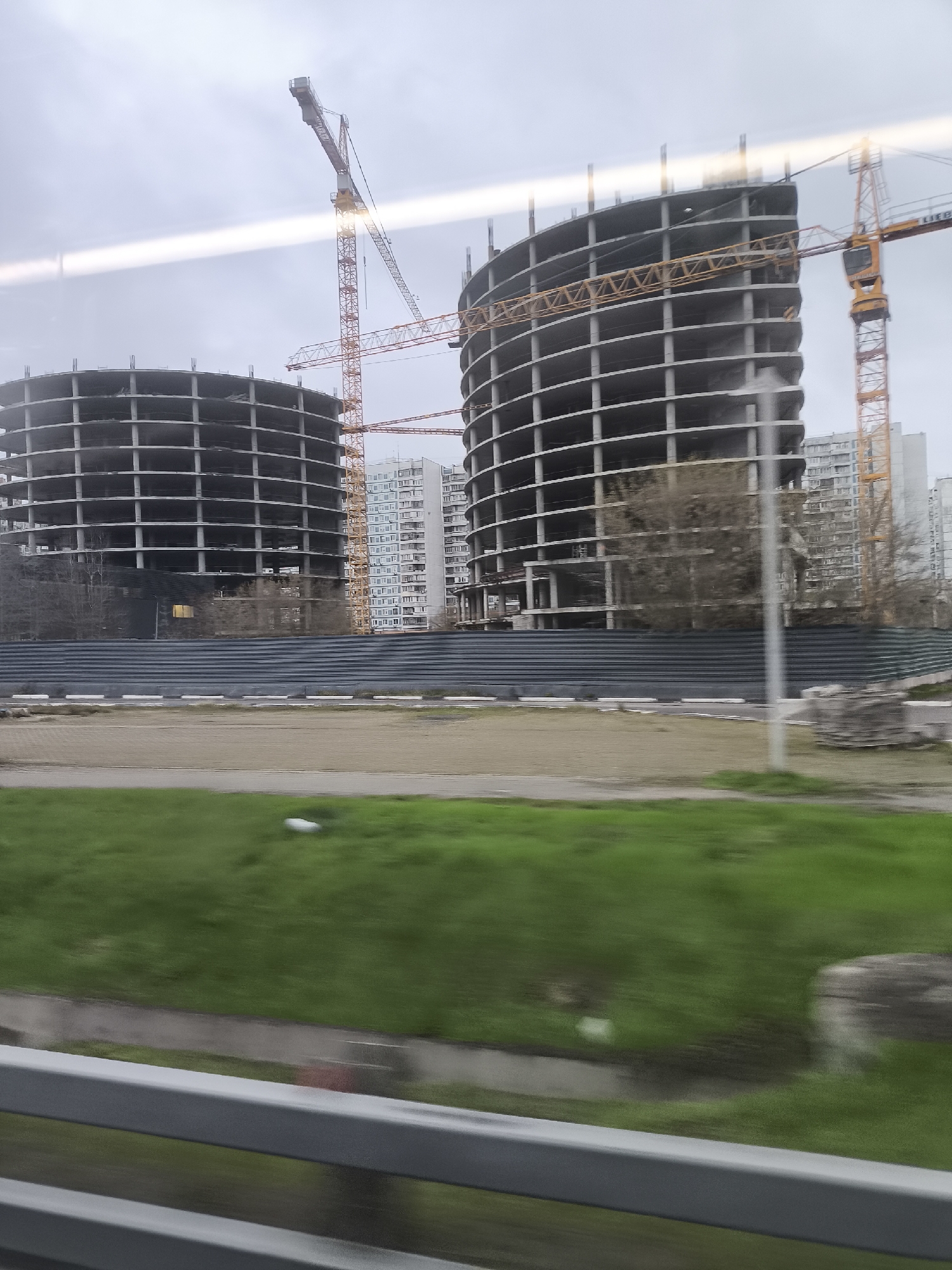 Circular concrete buildings under construction observed in Moscow