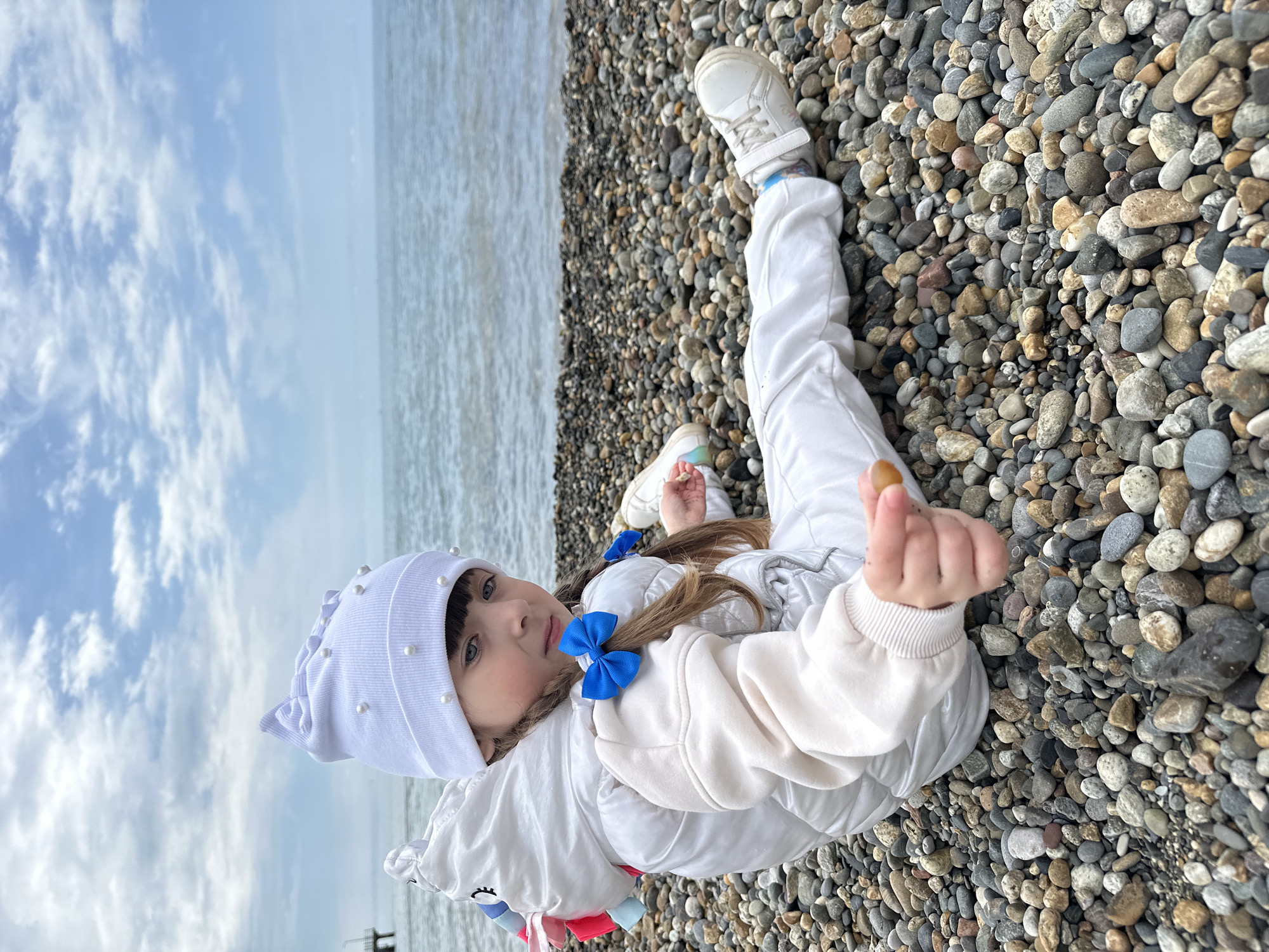 Family morning at Sochi's Marine Garden, child feeds pigeons