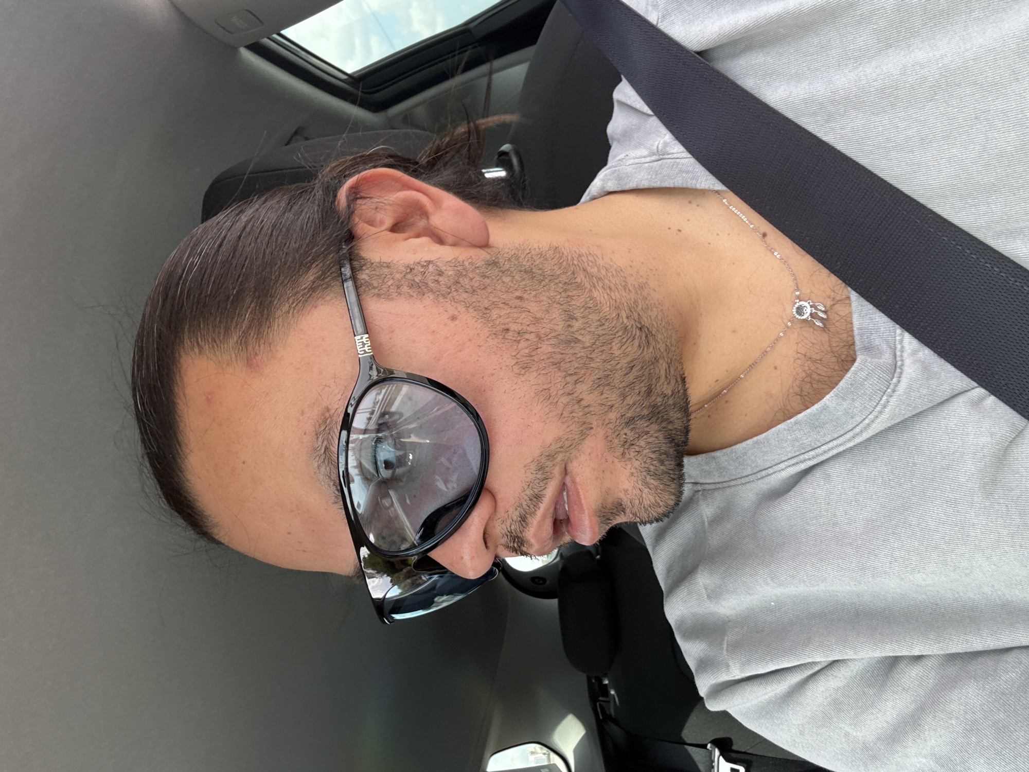 Man photographs himself in car in Mexico neighborhood
