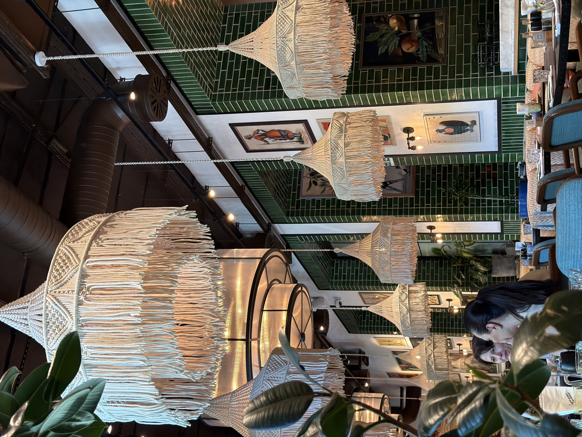 Eclectic Baku restaurant with macrame lamps and folk-style decor