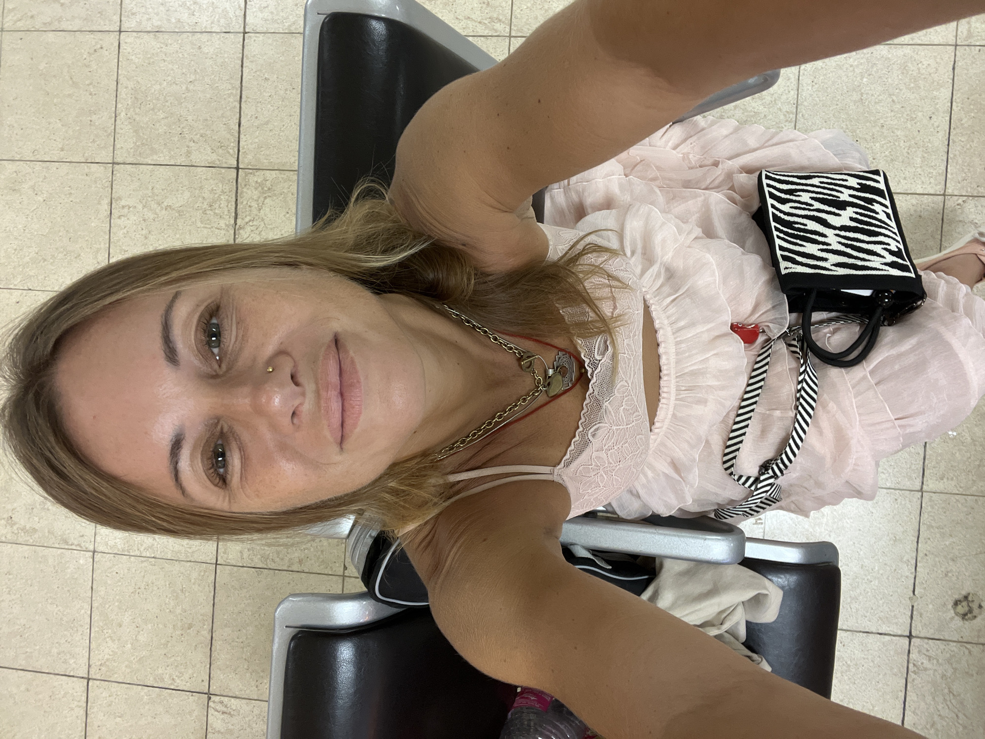 Pink dress, airport terminal, selfies and twirling in Katunayake