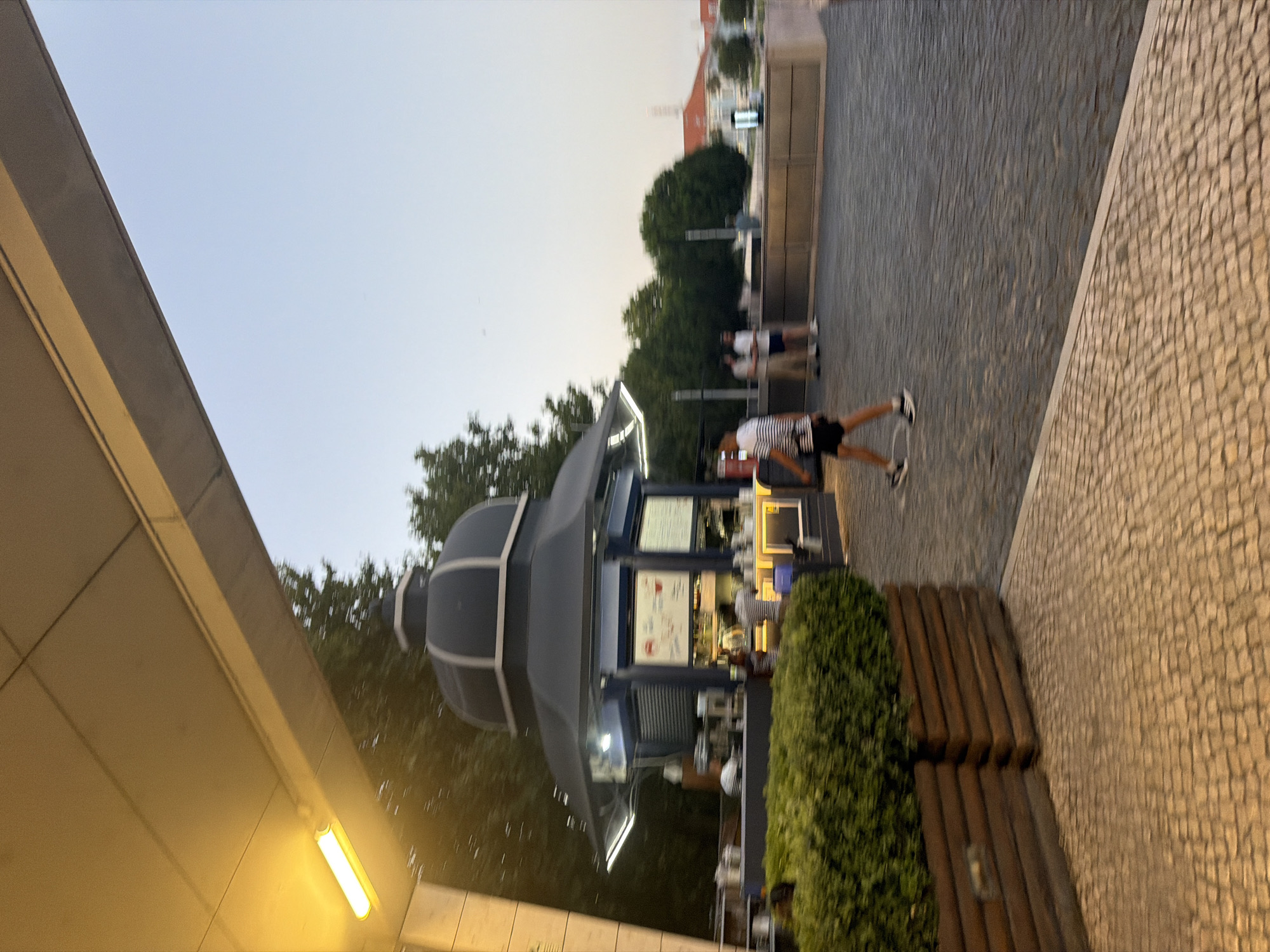 Lisbon's Tagus riverfront promenade busy at dusk