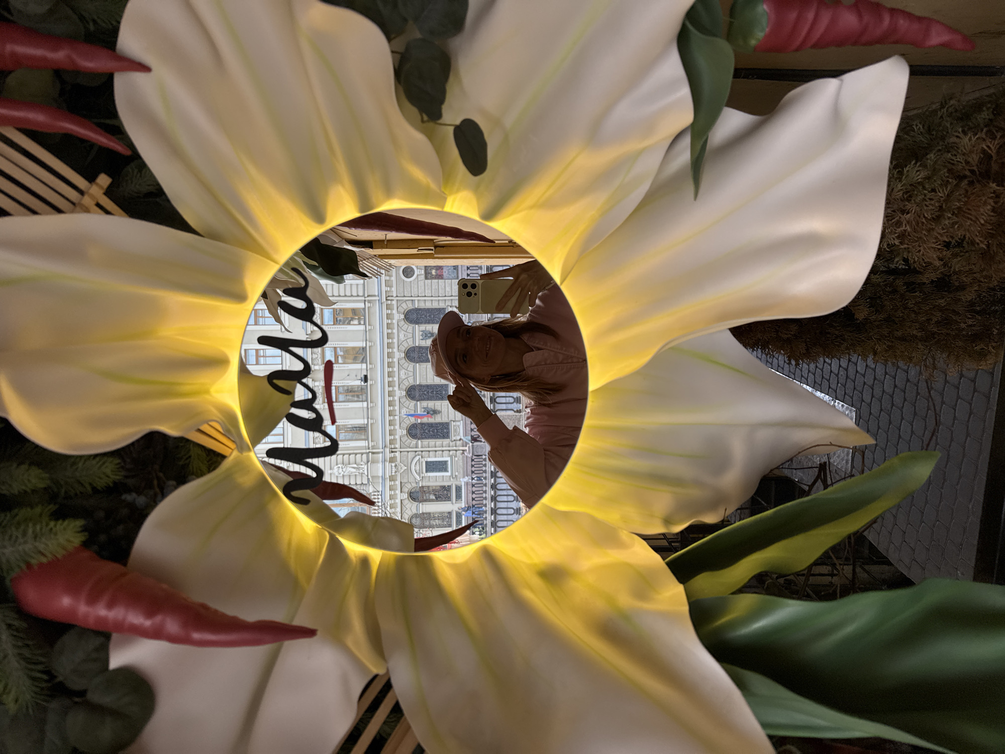 Tourist captures selfies and street scenes near historic Saint Petersburg church