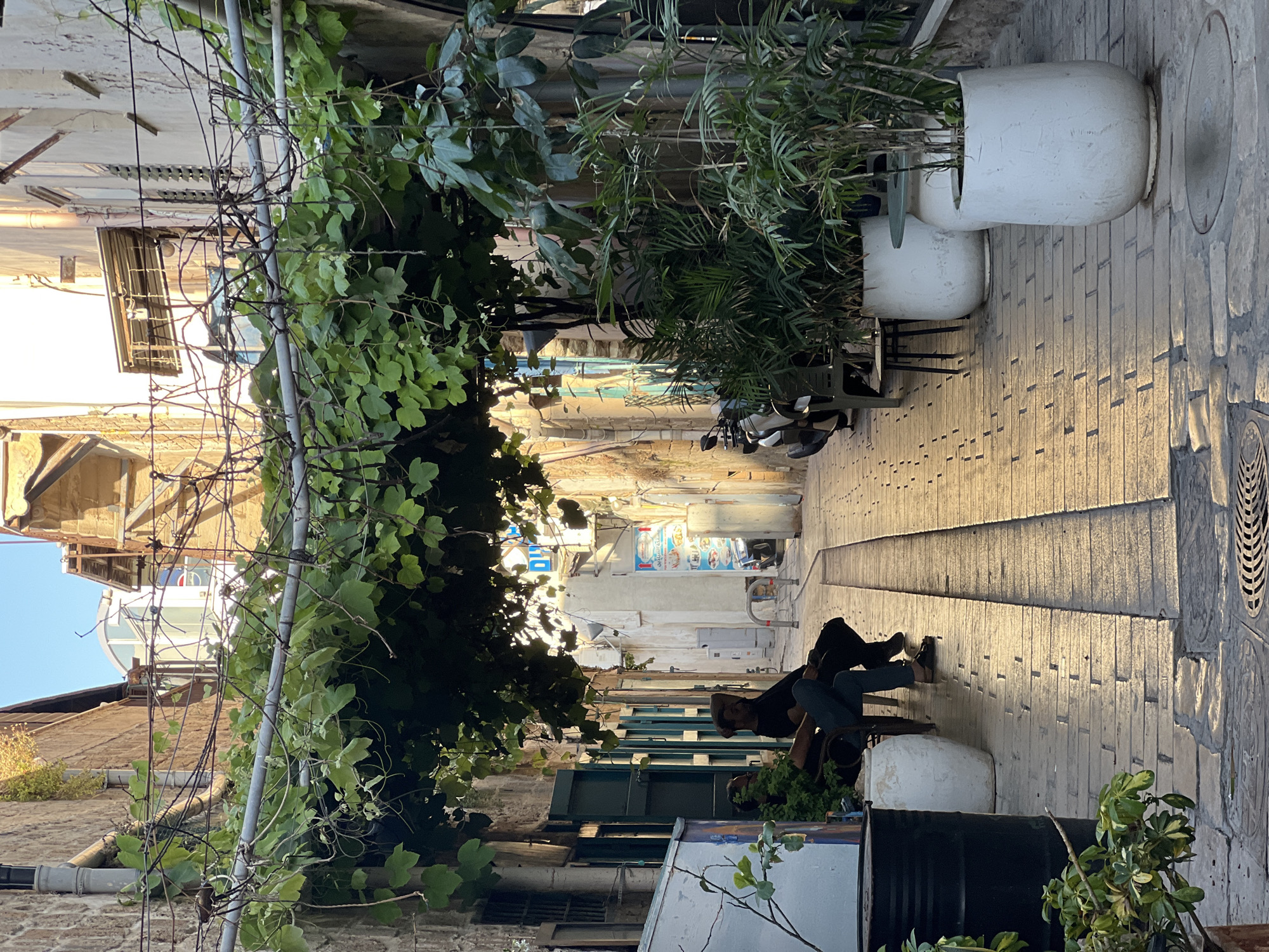Tourist documents walking tour through historic Old City Acre