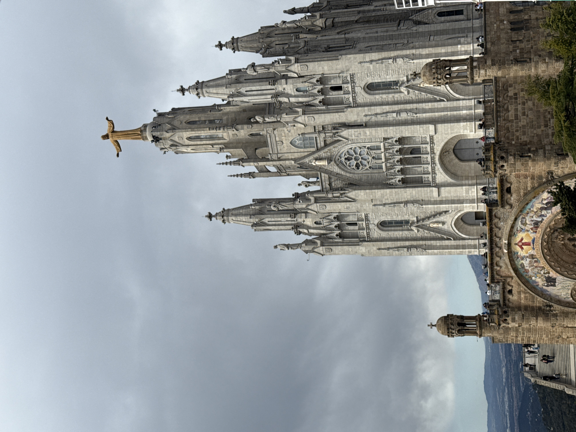 Visitors document rides and views at Barcelona's Tibidabo Amusement Park