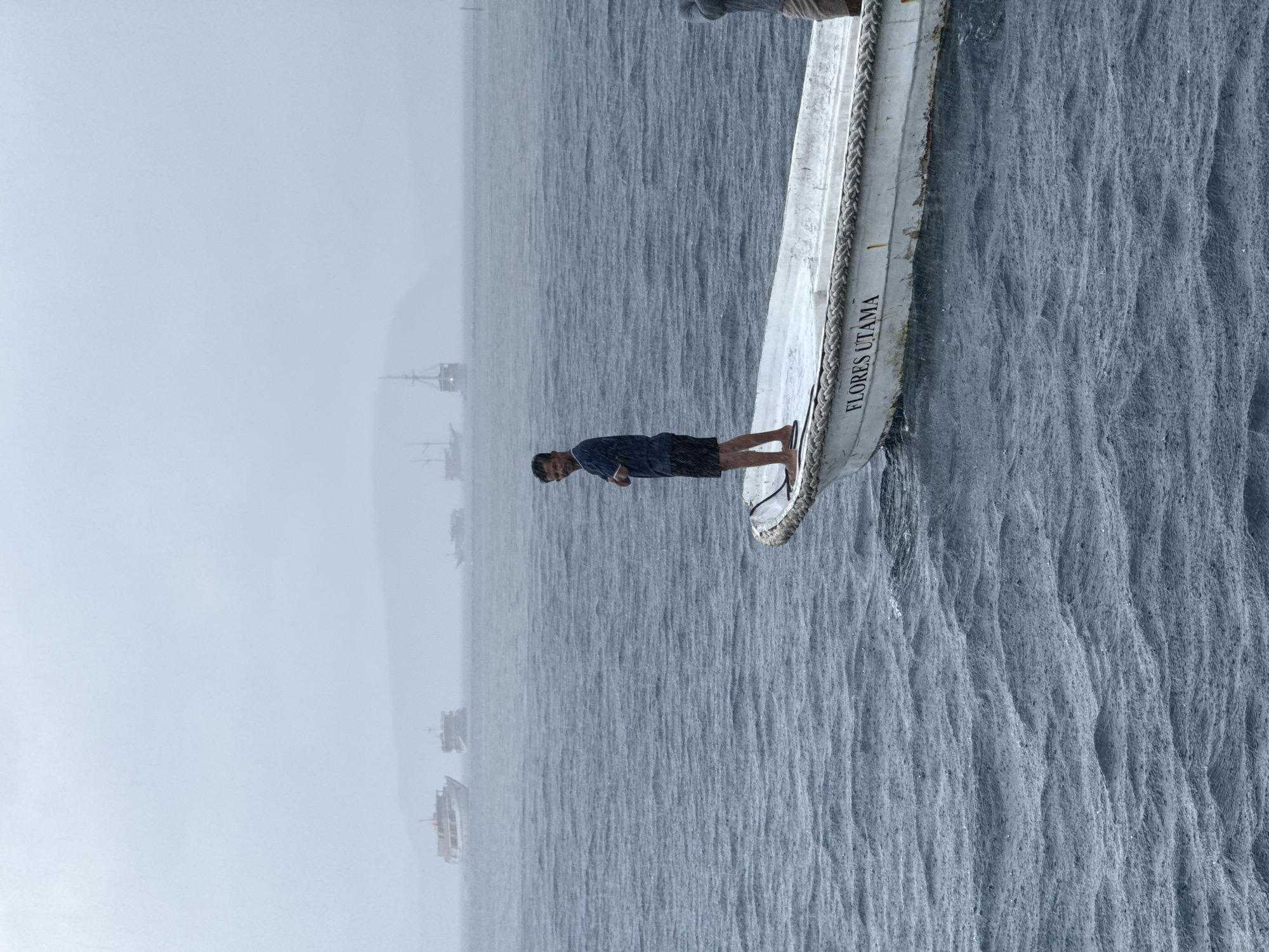 Morning fog shrouds boats off Indonesian coast